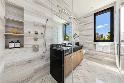 a large kitchen with kitchen island a sink stove and a granite counter top
