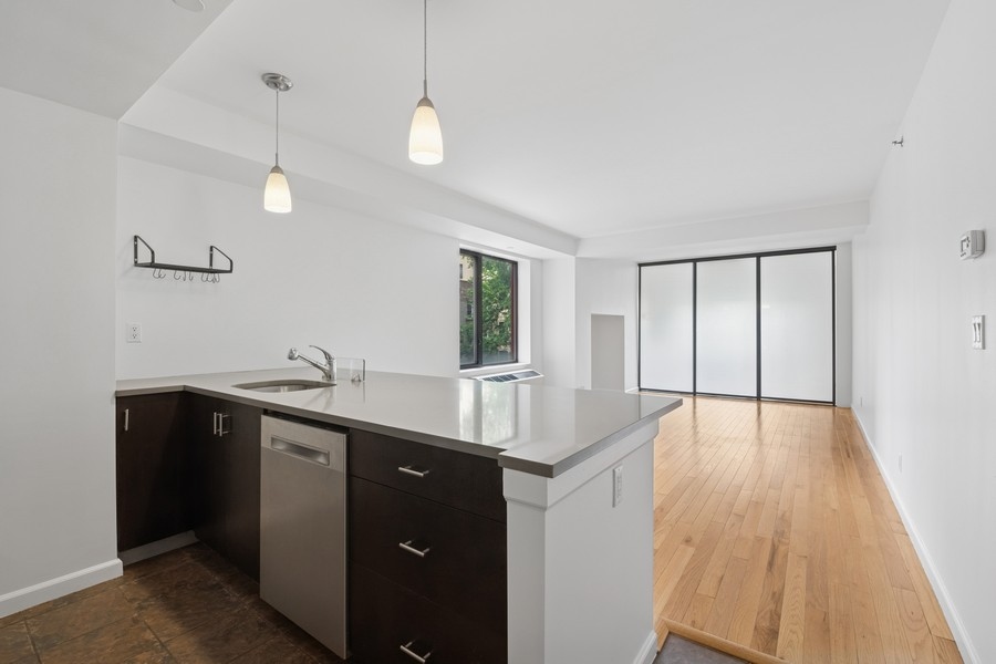 189 Avenue C, Unit 4D Manhattan, NY 10009 - Photo 10 of 17 a kitchen with sink and window