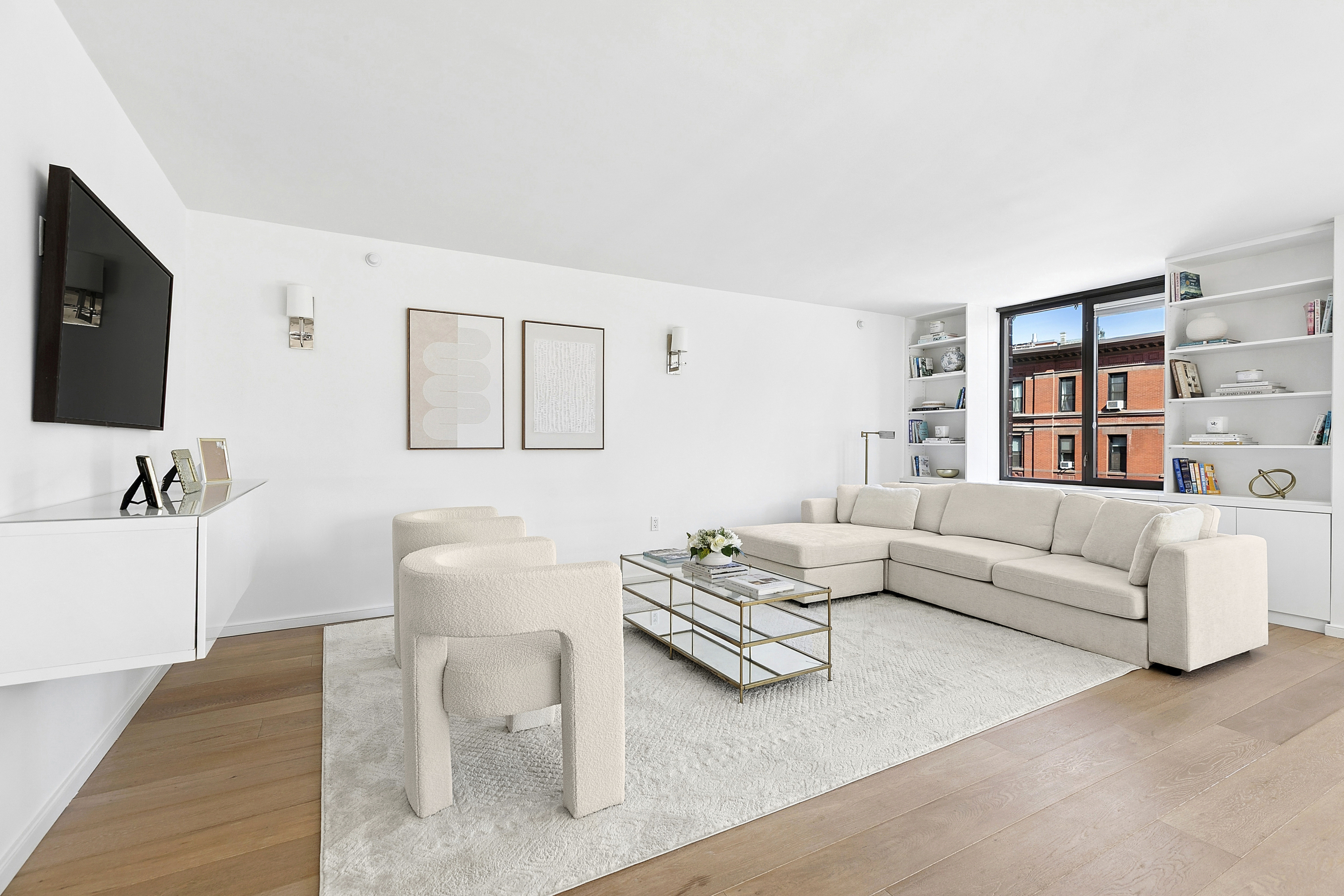 101 West 87th Street, Unit 505 Manhattan, NY 10024 - Photo 2 of 15 a living room with furniture and a flat screen tv