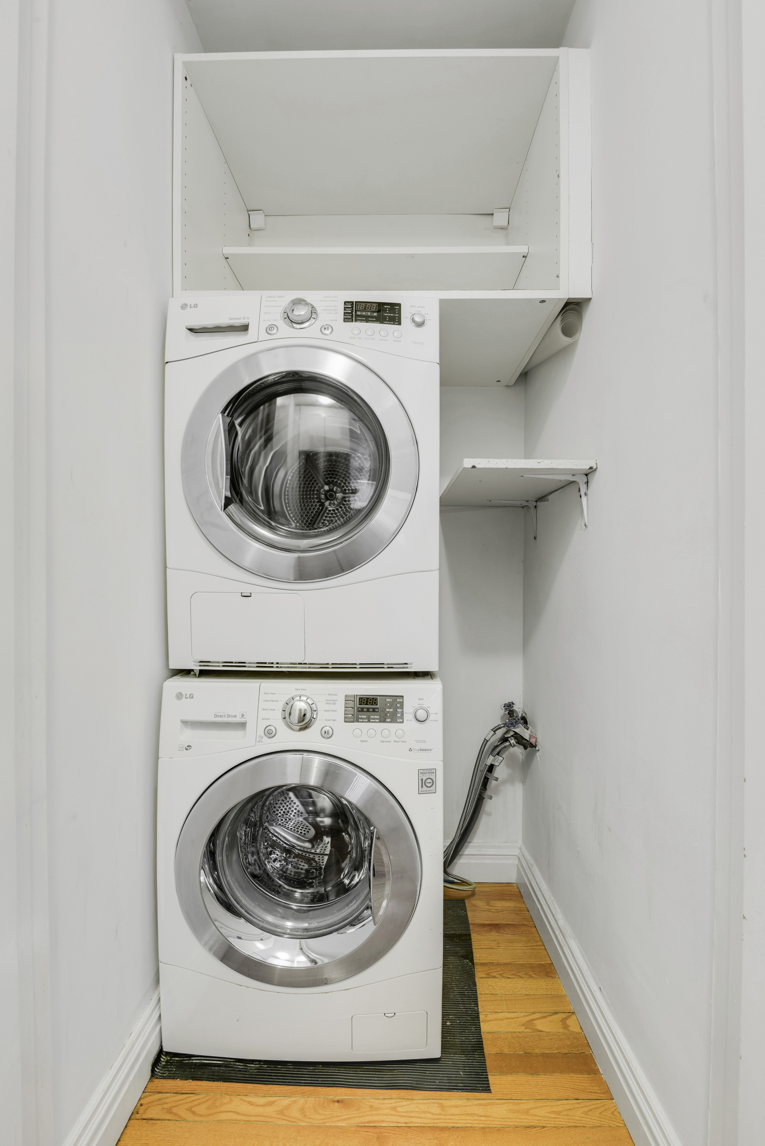 330 East 70th Street, Unit 4F Manhattan, NY 10021 - Photo 7 of 14 a utility room with dryer and washer