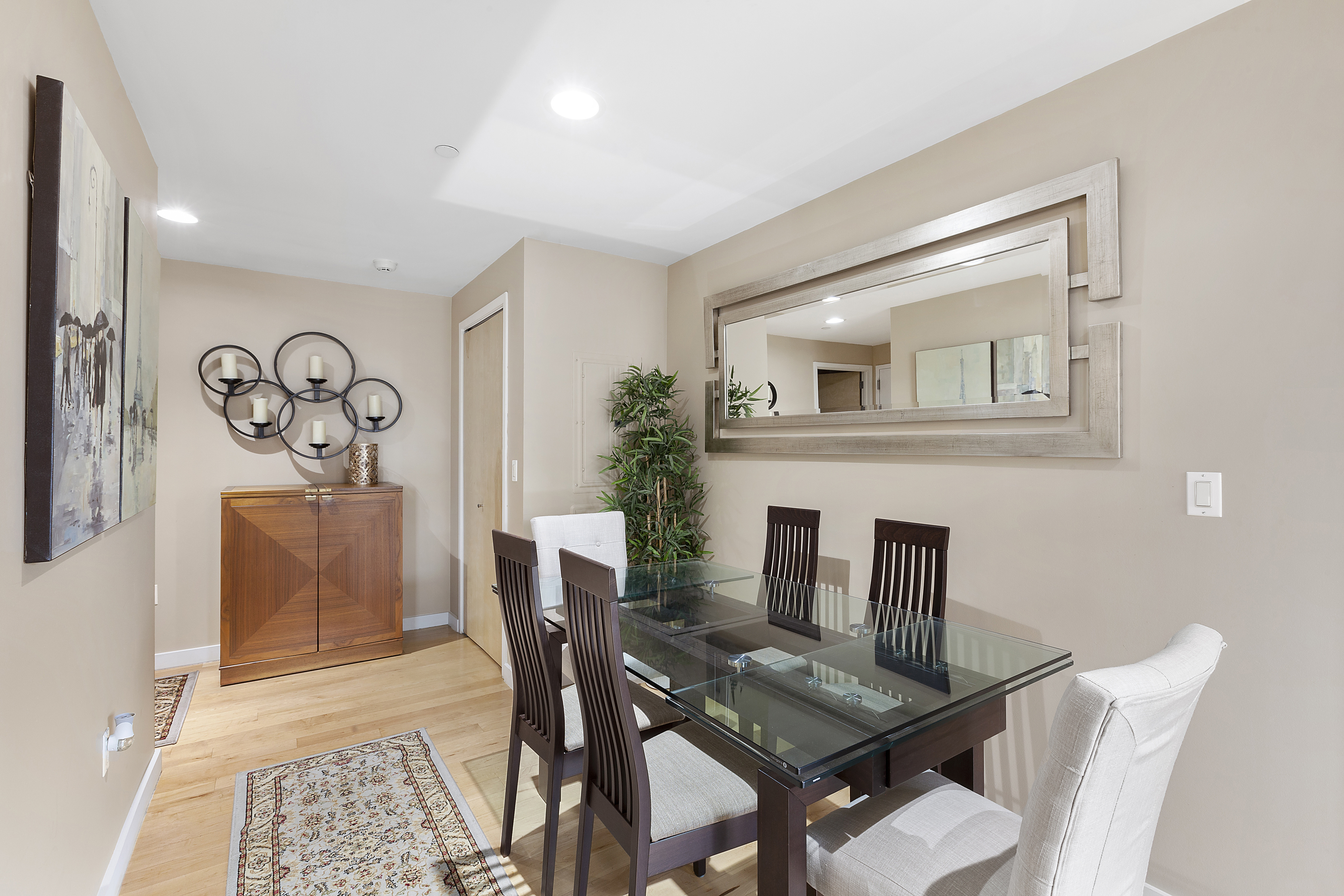 1595 Lexington Avenue, Unit 6E Manhattan, NY 10029 - Photo 3 of 13 a view of a workspace with furniture and wooden floor