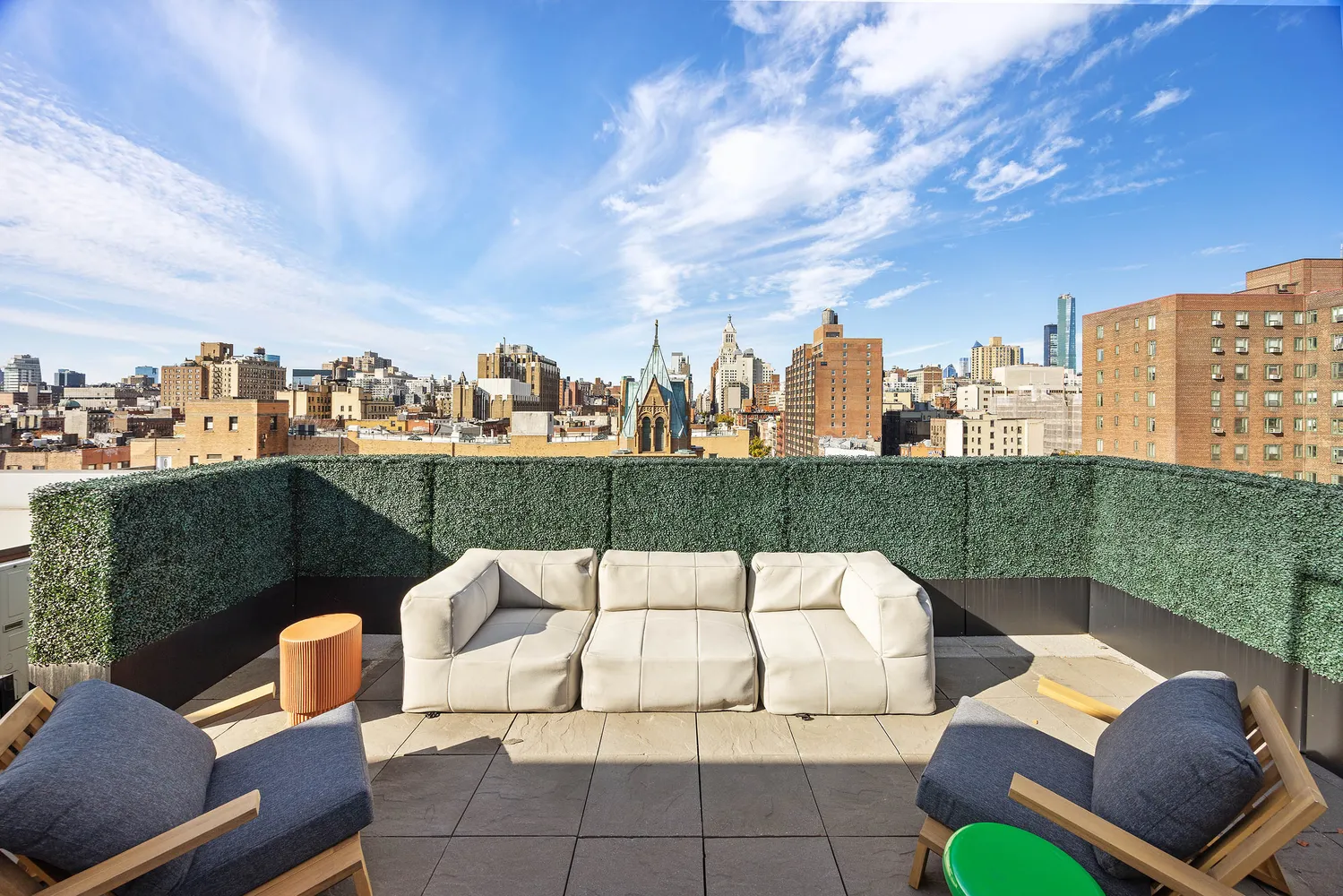 a view of a terrace with couches and pool