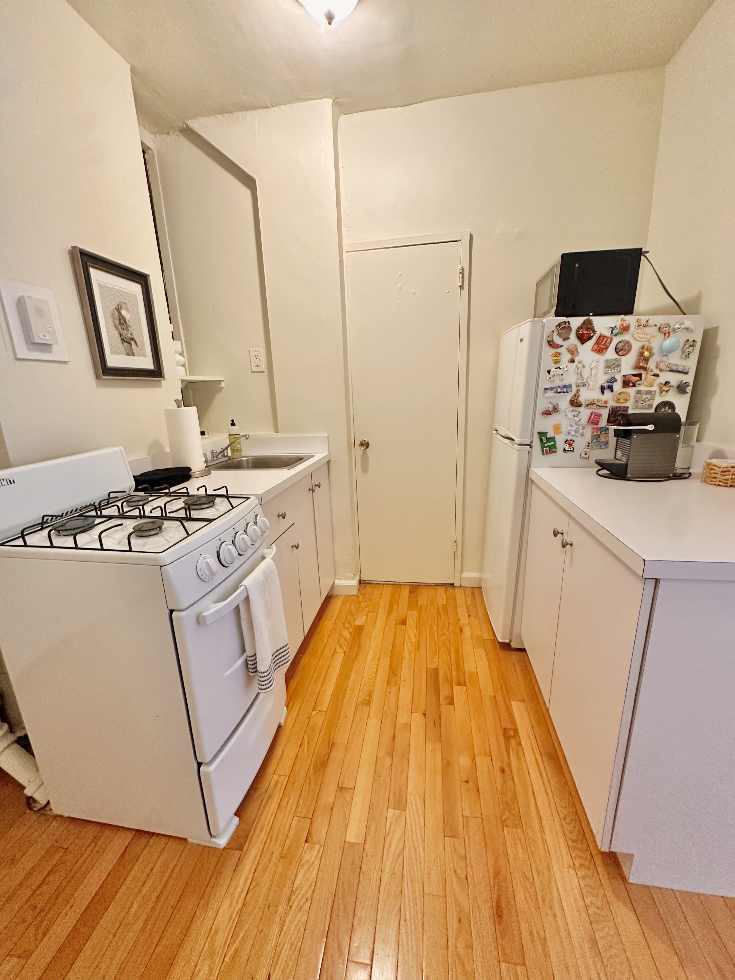 110 Thompson Street, Unit 1A Manhattan, NY 10012 - Photo 4 of 4 a spacious bedroom with a bed and a window