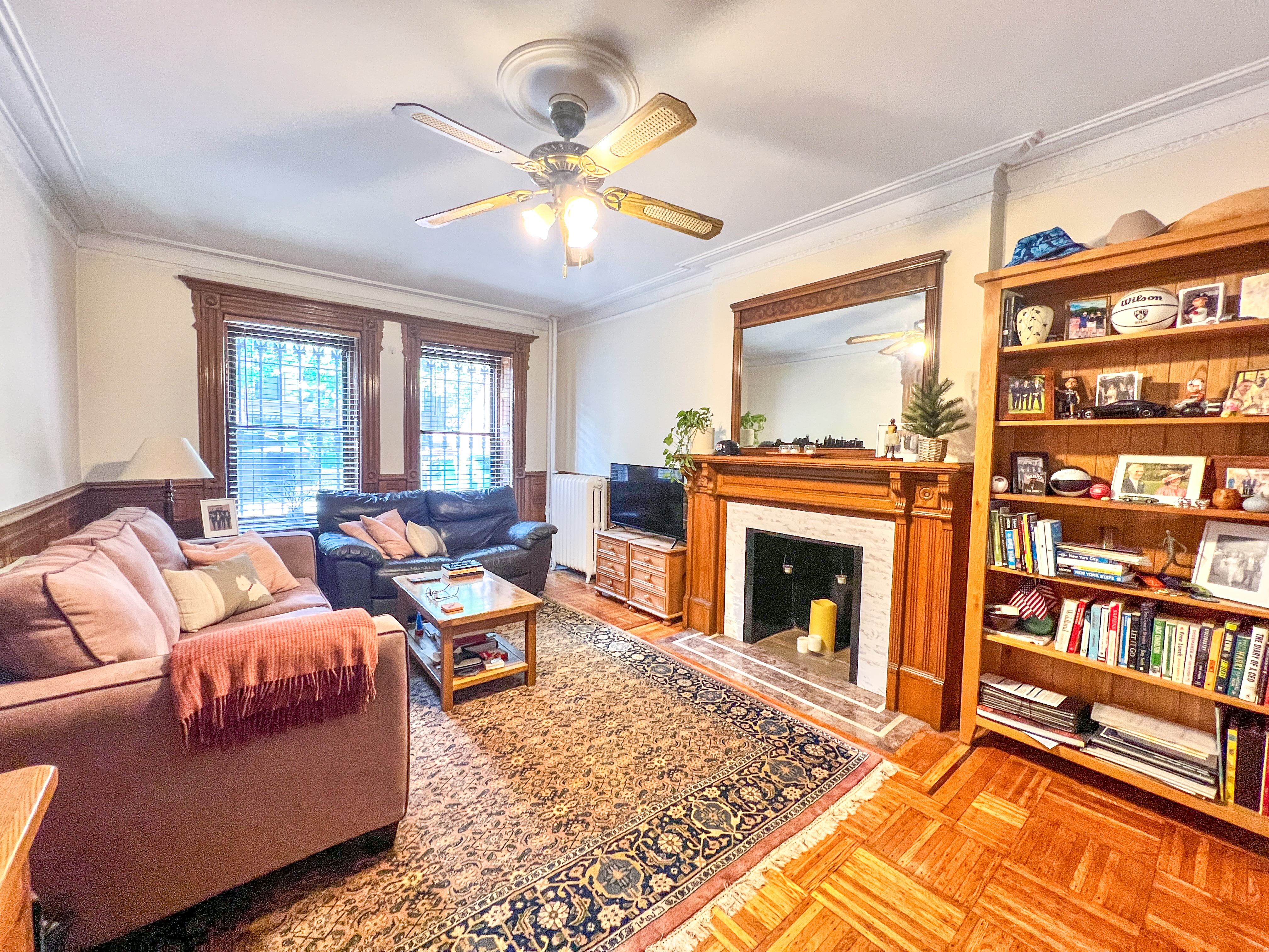 651 10th Street, Unit 1 Brooklyn, NY 11215 - Photo 2 of 12 a living room with furniture fireplace and a flat screen tv