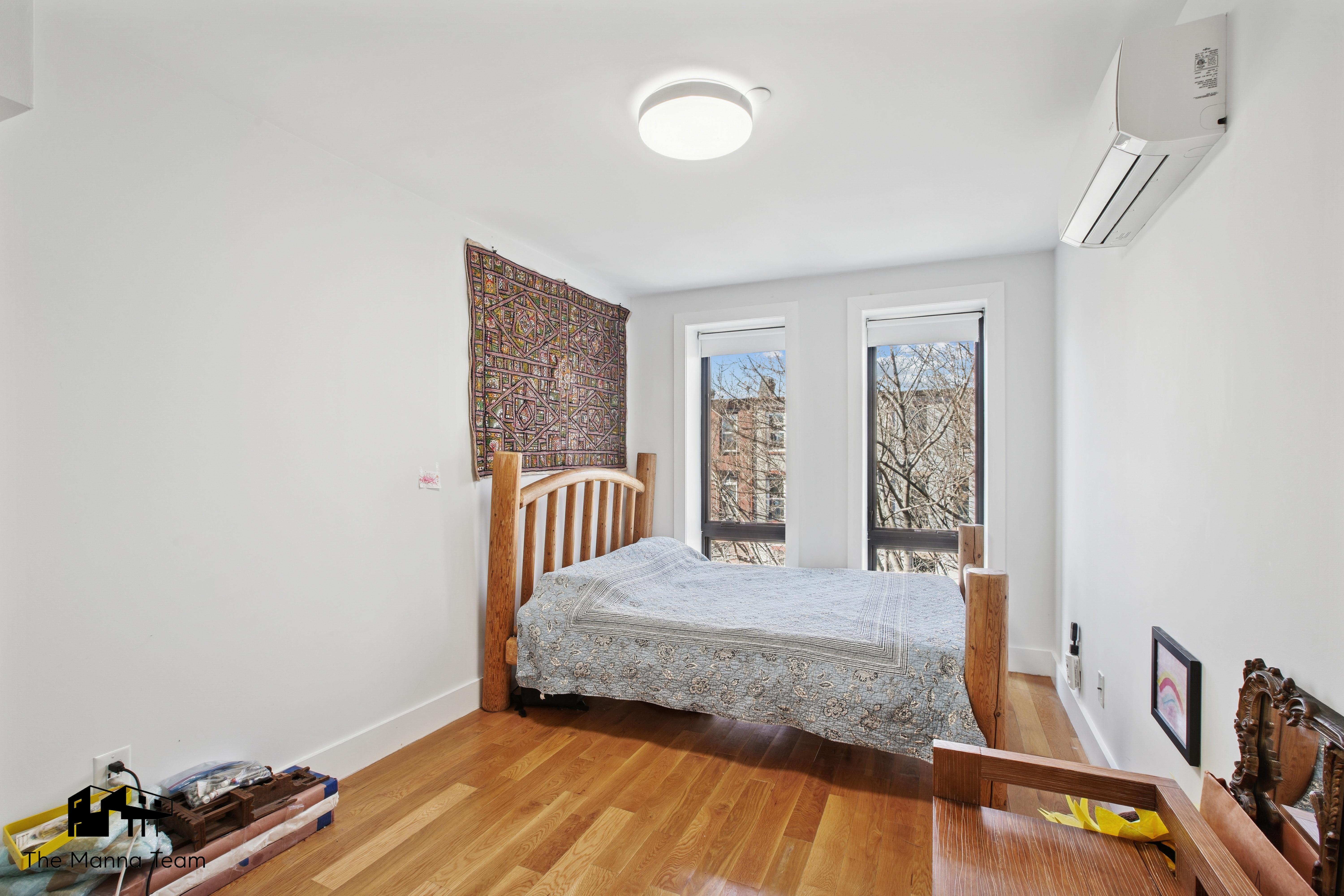 385 Jefferson Avenue, Unit C Brooklyn, NY 11221 - Photo 11 of 21 a bedroom with a bed and a window