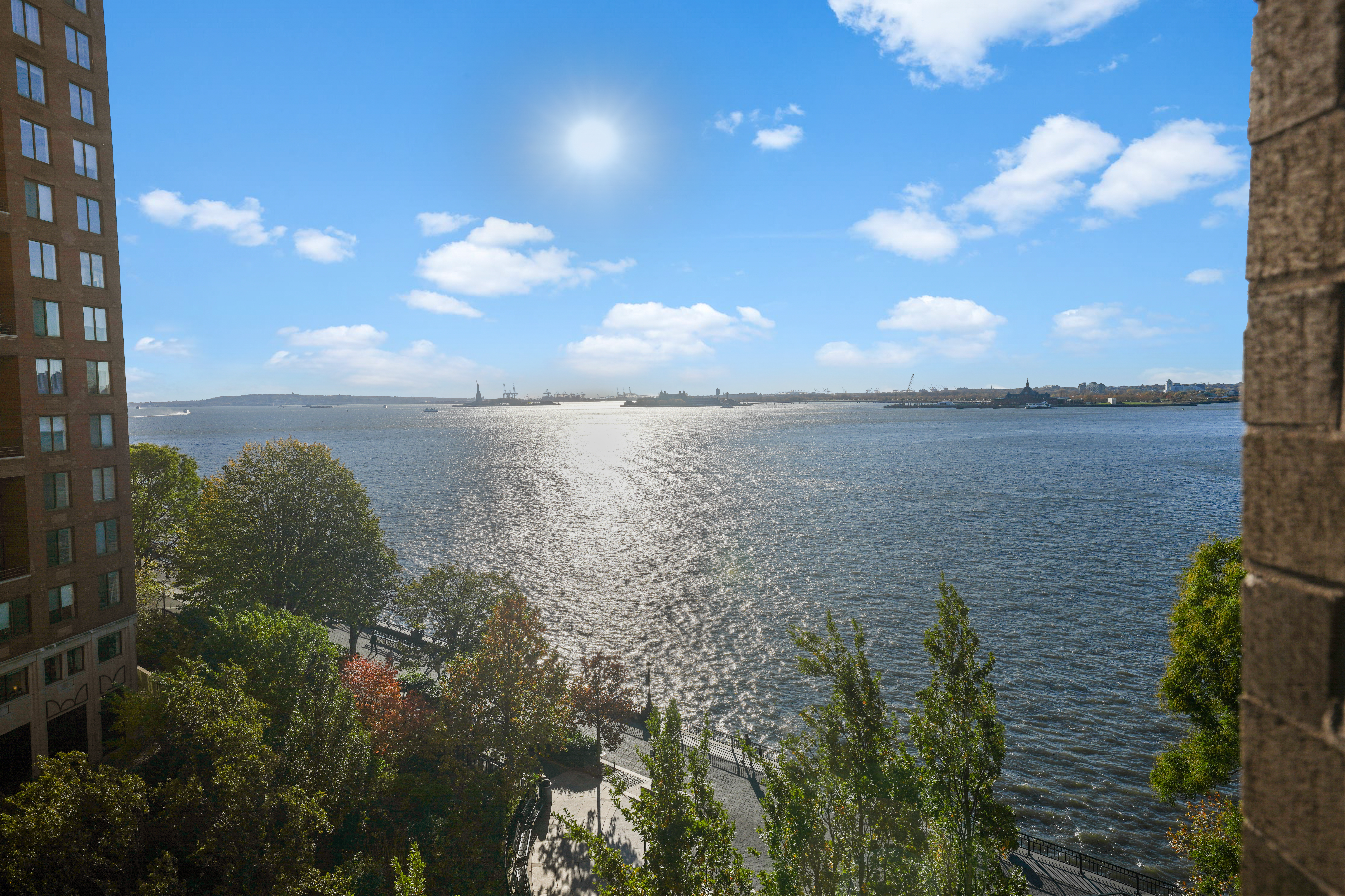 377 Rector Place, Unit 7K Manhattan, NY 10280 - Photo 8 of 11 a view of a lake from a yard