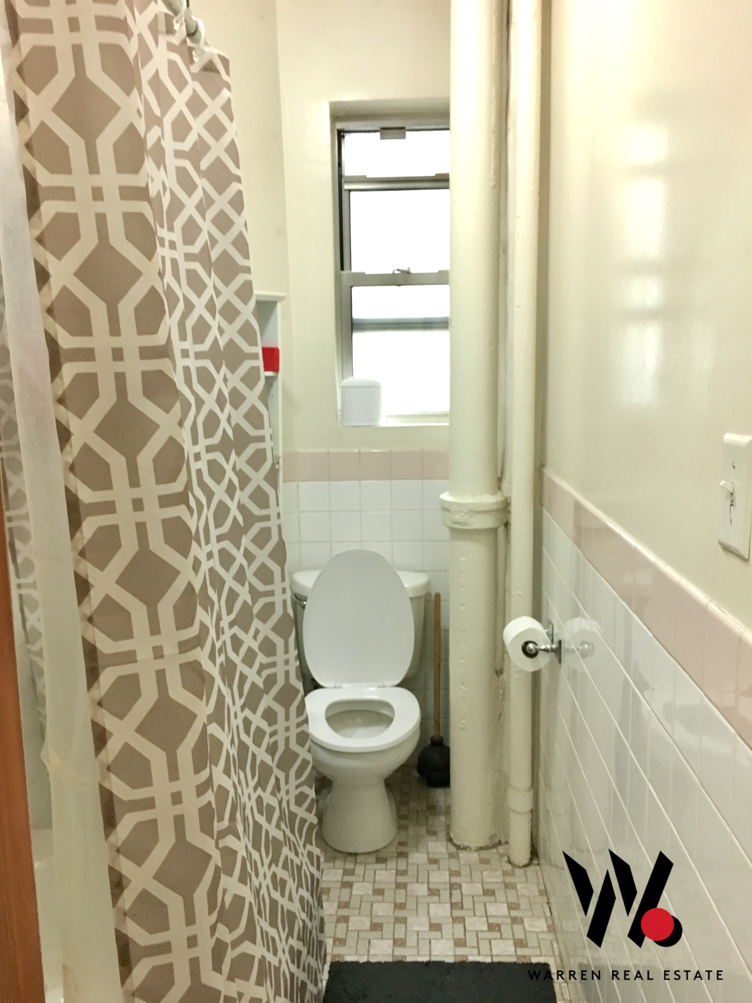 80 East 7th Street, Unit 4D Manhattan, NY 10003 - Photo 7 of 8 a bathroom with a toilet and a shower curtain