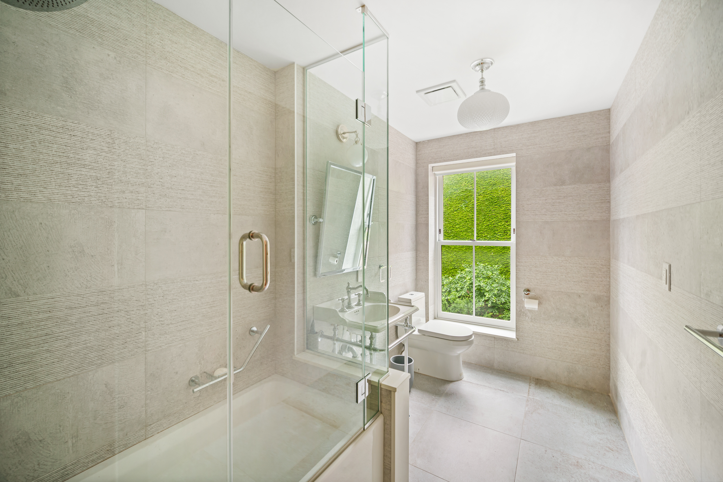 265 6th Avenue Brooklyn, NY 11215 - Photo 16 of 24 a bathroom with a bathtub and a shower