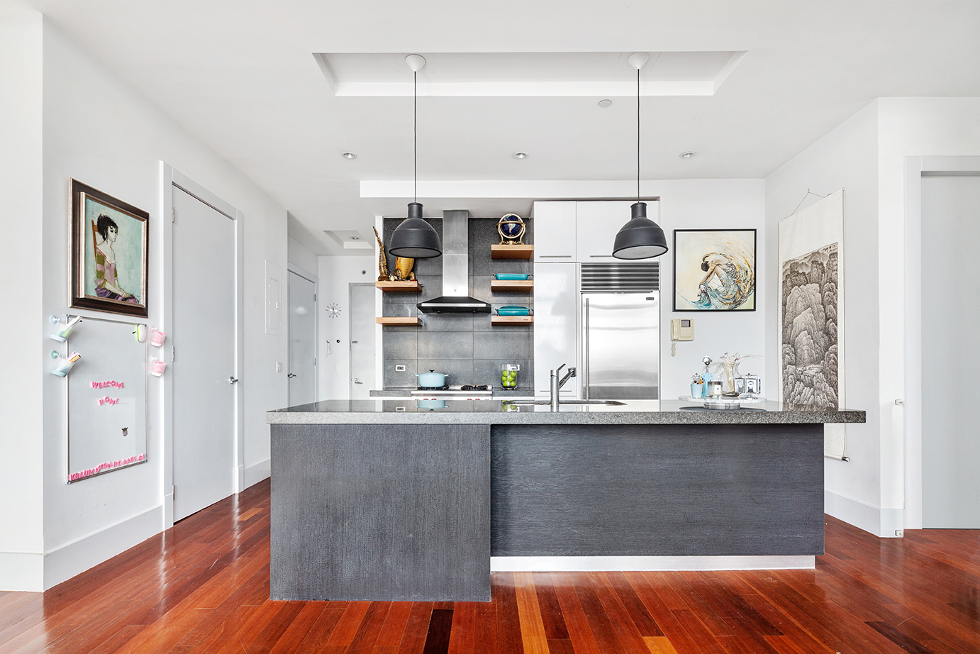 60 Broadway, Unit 6A Brooklyn, NY 11249 - Photo 4 of 14 a kitchen with kitchen island granite countertop a sink cabinets and stainless steel appliances