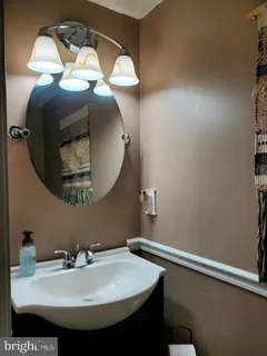 a white toilet sitting next to a small bathroom