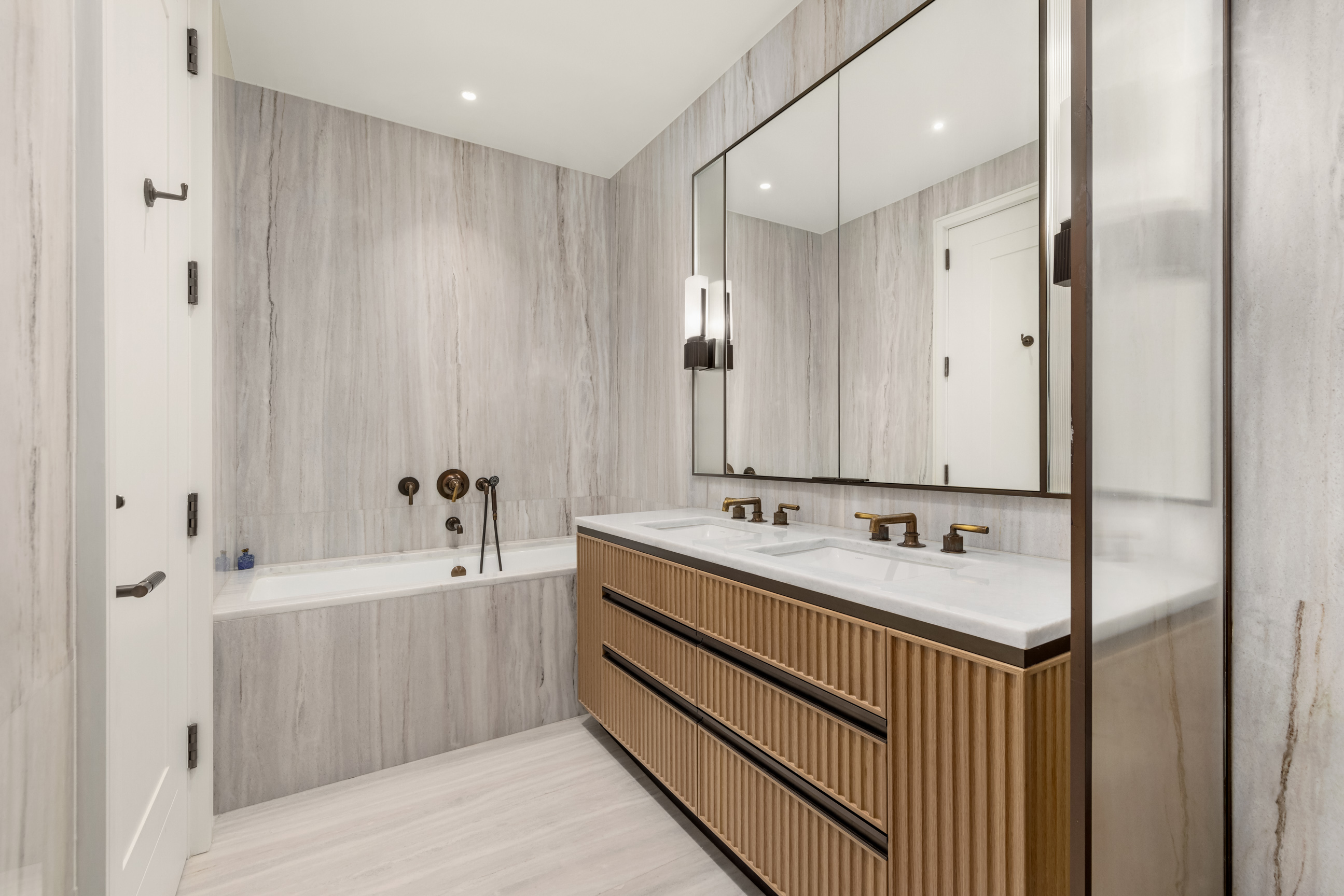 515 West 18th Street, Unit 1102 Manhattan, NY 10011 - Photo 11 of 18 a bathroom with a double vanity sink and mirror