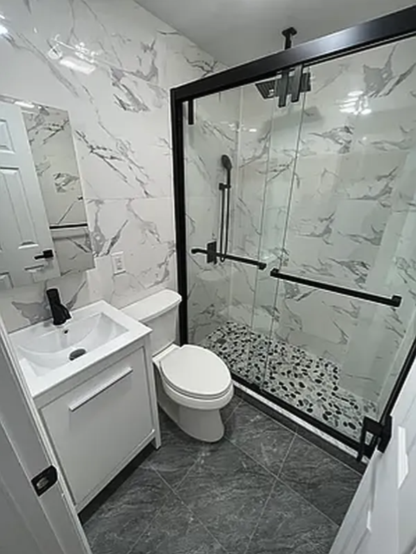 332 9th Street, Unit 4 Brooklyn, NY 11215 - Photo 7 of 8 a bathroom with a sink toilet and shower