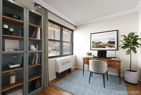 a room with furniture cabinets and window