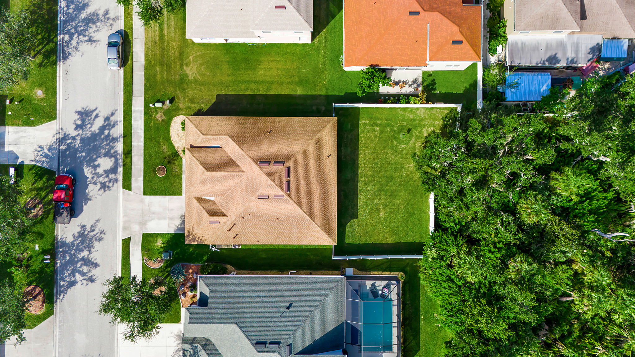 6106 34th Court East Bradenton, FL 34203 - Photo 65 of 69 an aerial view of a house with a garden and trees