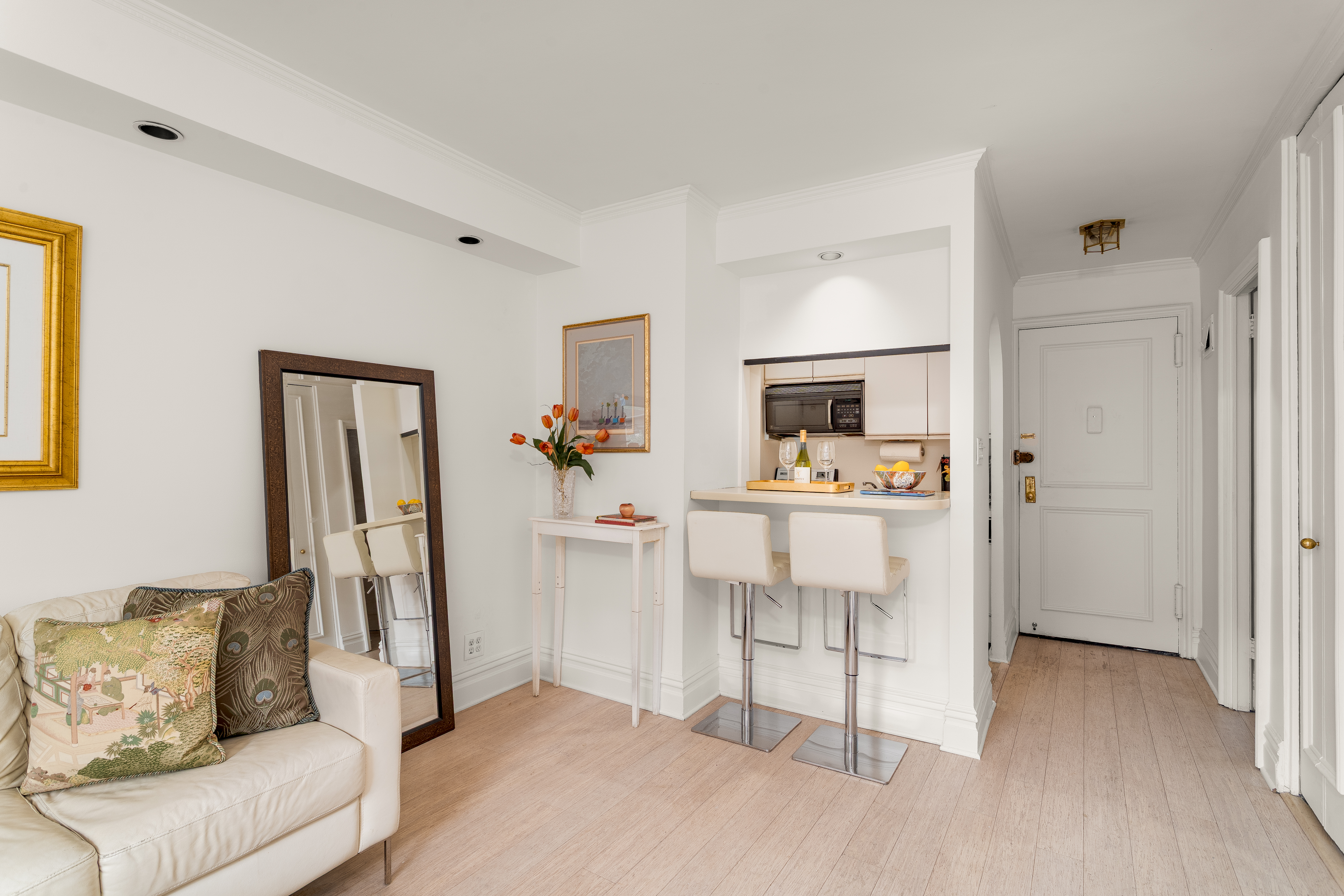 251 East 51st Street, Unit 6K Manhattan, NY 10022 - Photo 3 of 16 a living room with furniture and a wooden floor