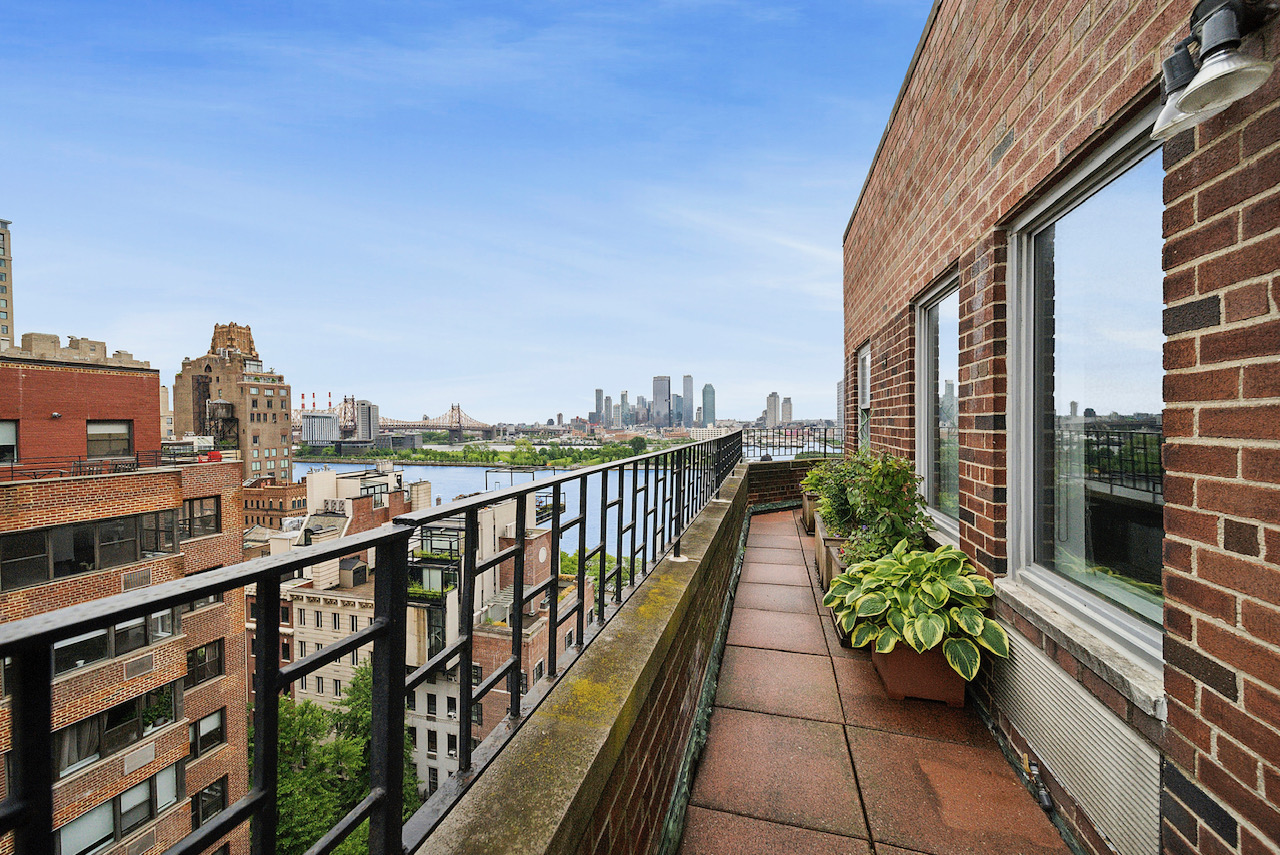 12 Beekman Place, Unit PHA Manhattan, NY 10022 - Photo 3 of 12 a view of city from a balcony