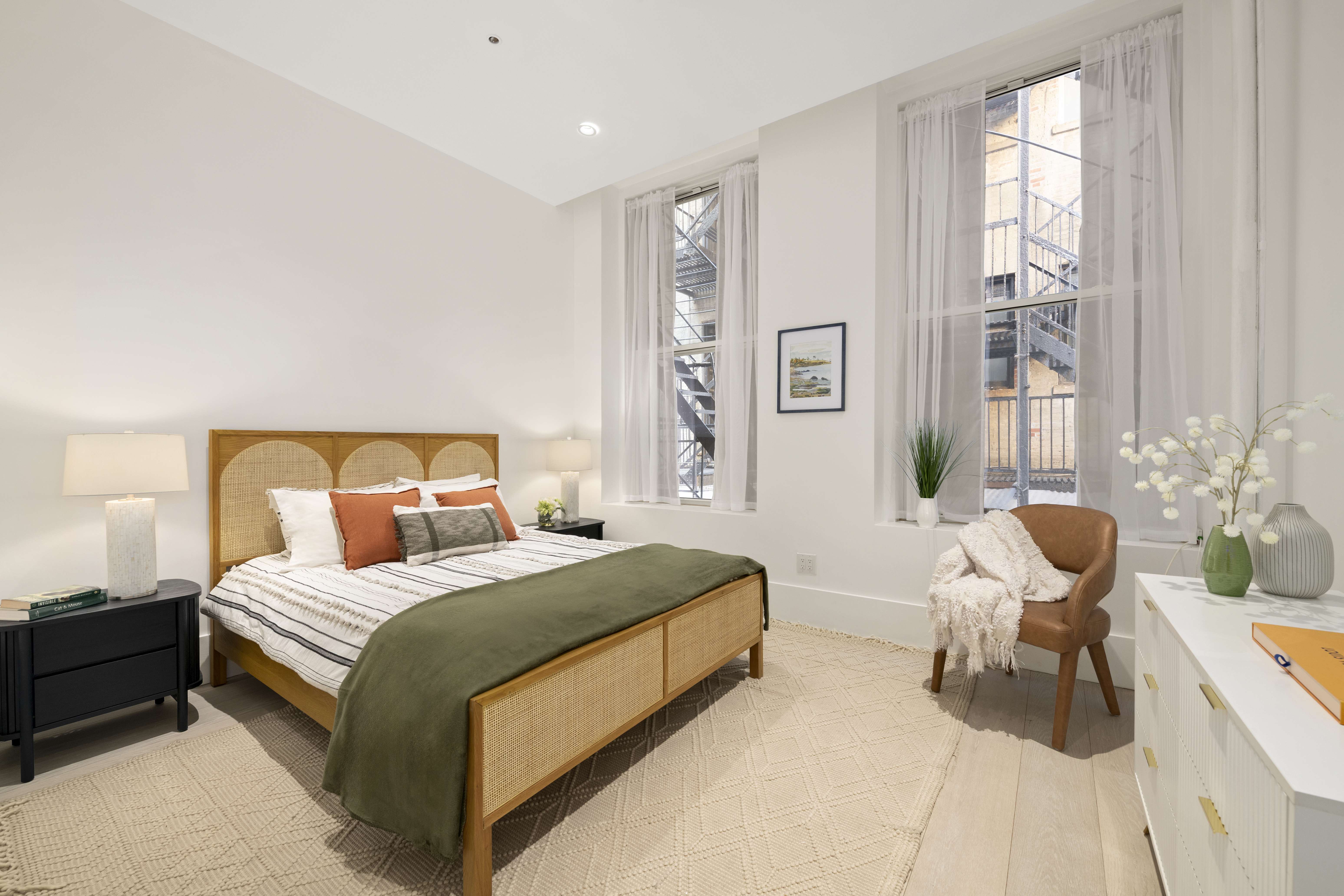 48 West 22nd Street, Unit 2 Manhattan, NY 10010 - Photo 5 of 8 a bedroom with a bed and a chair