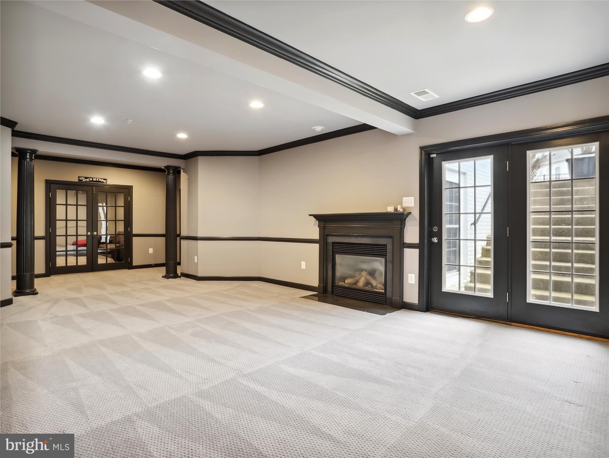 14302 Derby Ridge Road Bowie, MD 20721 - Photo 51 of 67 a view of an empty room with a fireplace and a window
