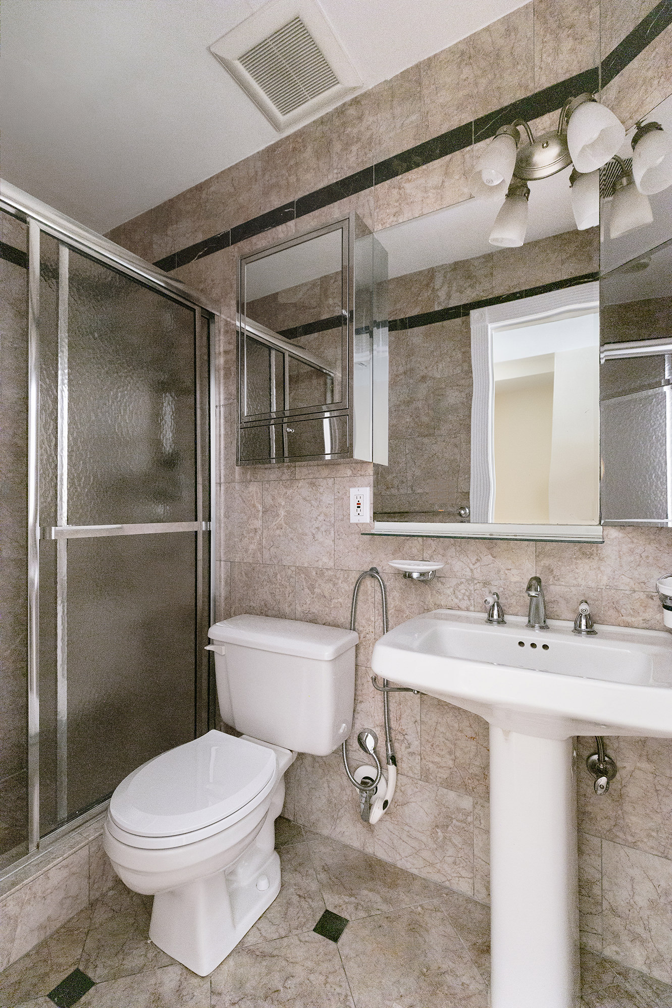 23 East 81st Street, Unit 1 Manhattan, NY 10028 - Photo 20 of 23 a bathroom with a sink toilet and shower