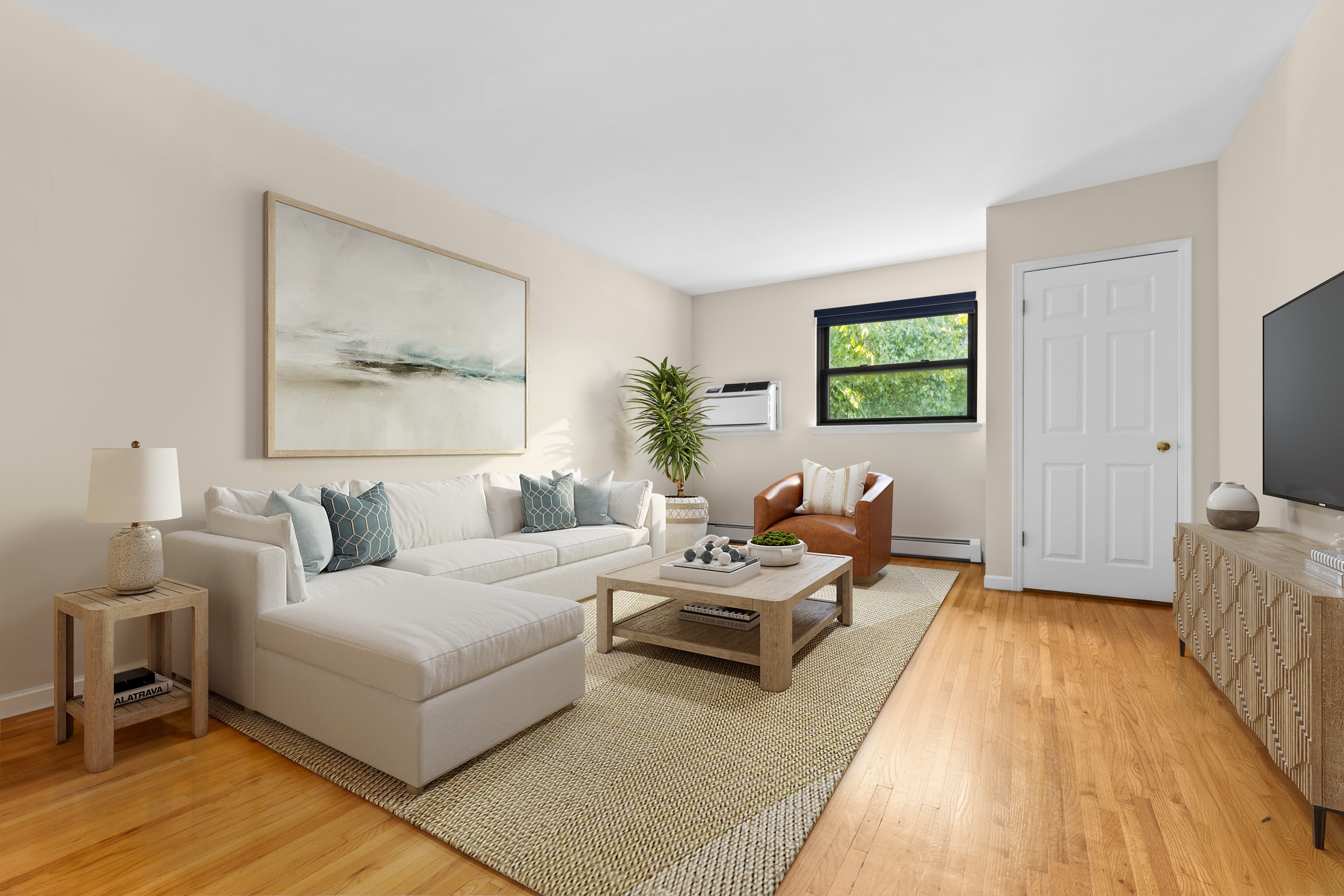 a living room with furniture and a flat screen tv