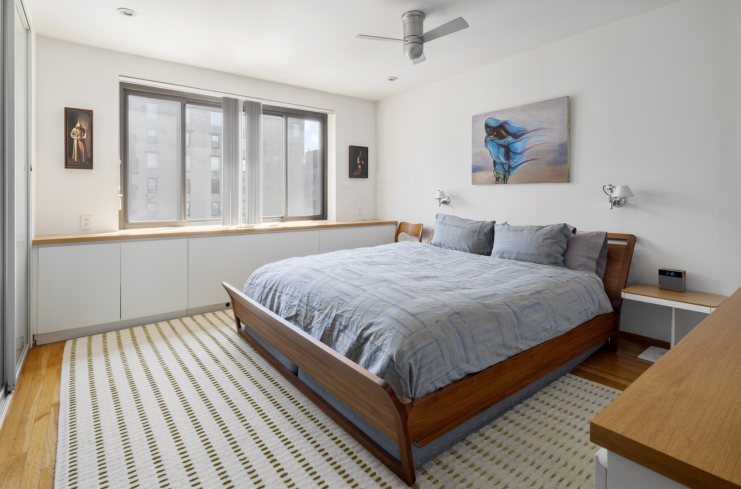 181 7th Avenue, Unit 11A Manhattan, NY 10011 - Photo 7 of 13 a bedroom with a large bed and a window