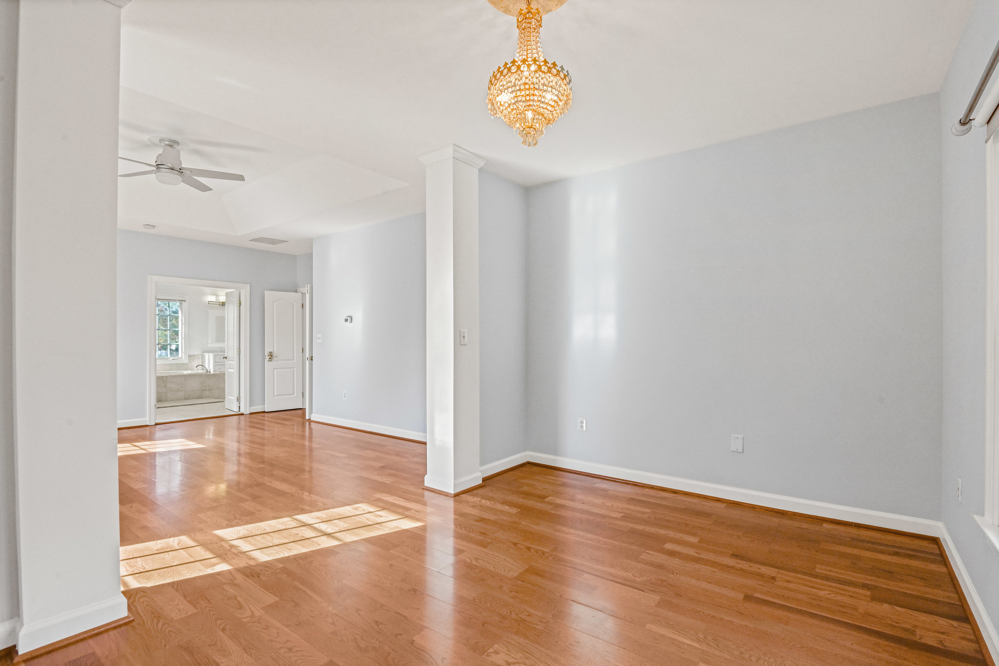2628 Five Oaks Road Vienna, VA 22181 - Photo 21 of 40 an empty room with wooden floor and windows