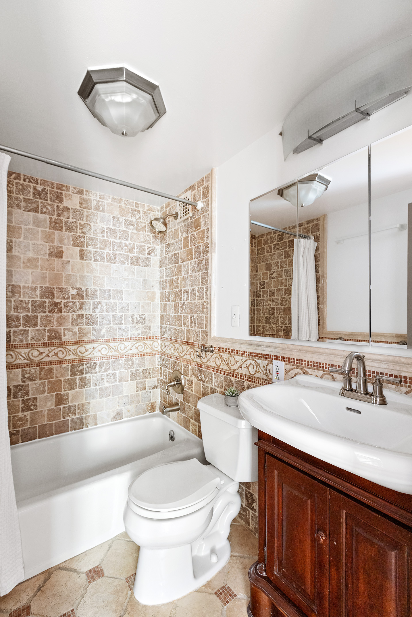 107 West 78th Street, Unit B Manhattan, NY 10024 - Photo 8 of 15 a bathroom with a sink a toilet and shower