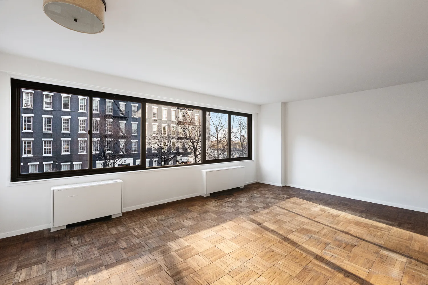 a view of an empty room with a window