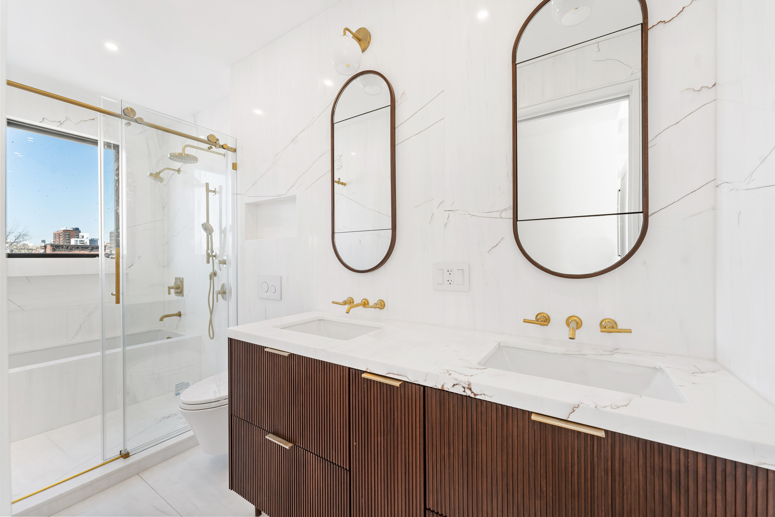 167 13th Street, Unit PH Brooklyn, NY 11215 - Photo 10 of 14 a bathroom with a sink and a mirror