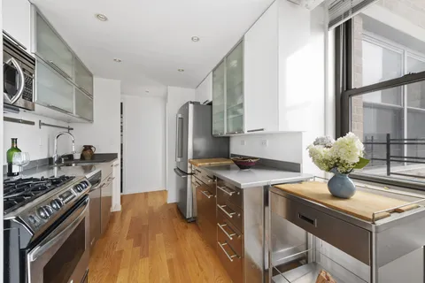 a kitchen with a stove and a refrigerator