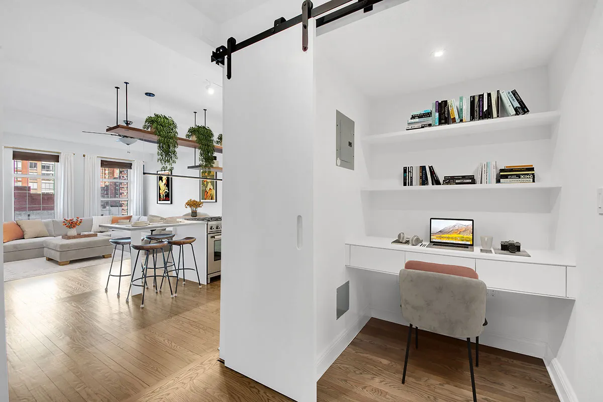 a living room with furniture and a table