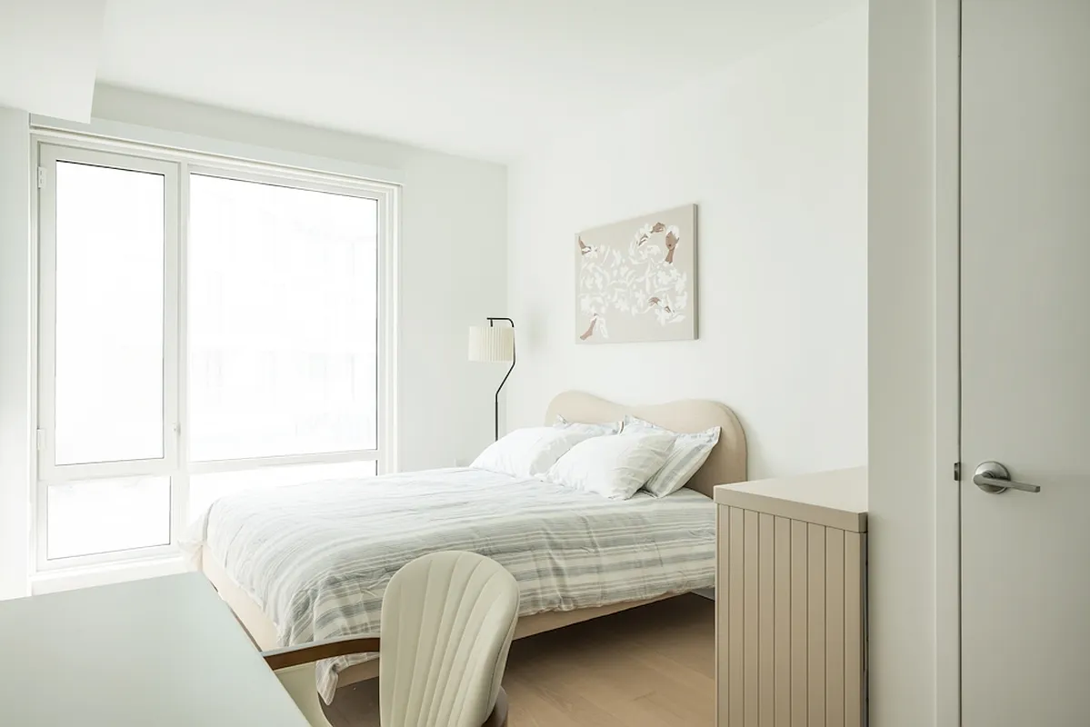 975 Nostrand Avenue, Unit 241 Brooklyn, NY 11225 - Photo 3 of 18 a bedroom with a bed and a window