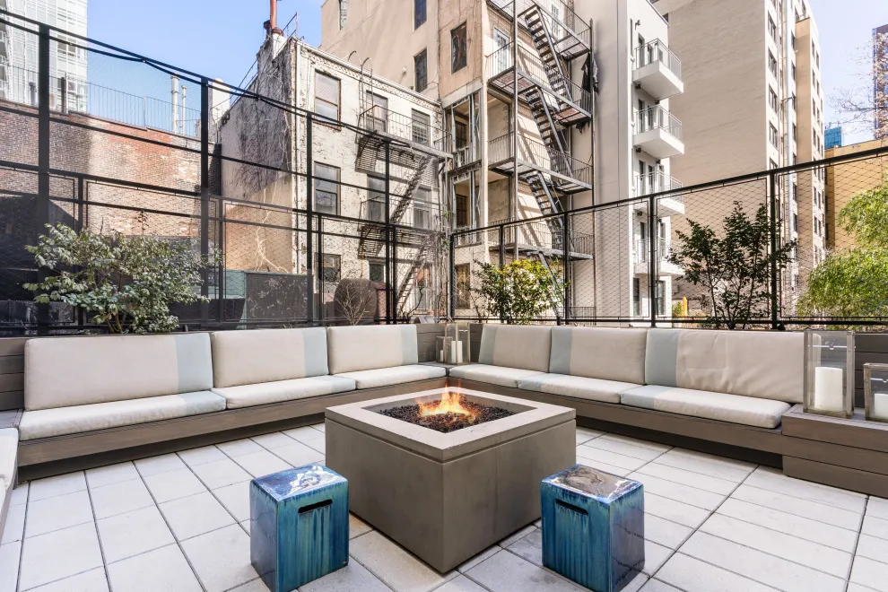 a view of a terrace with couches and a potted plant