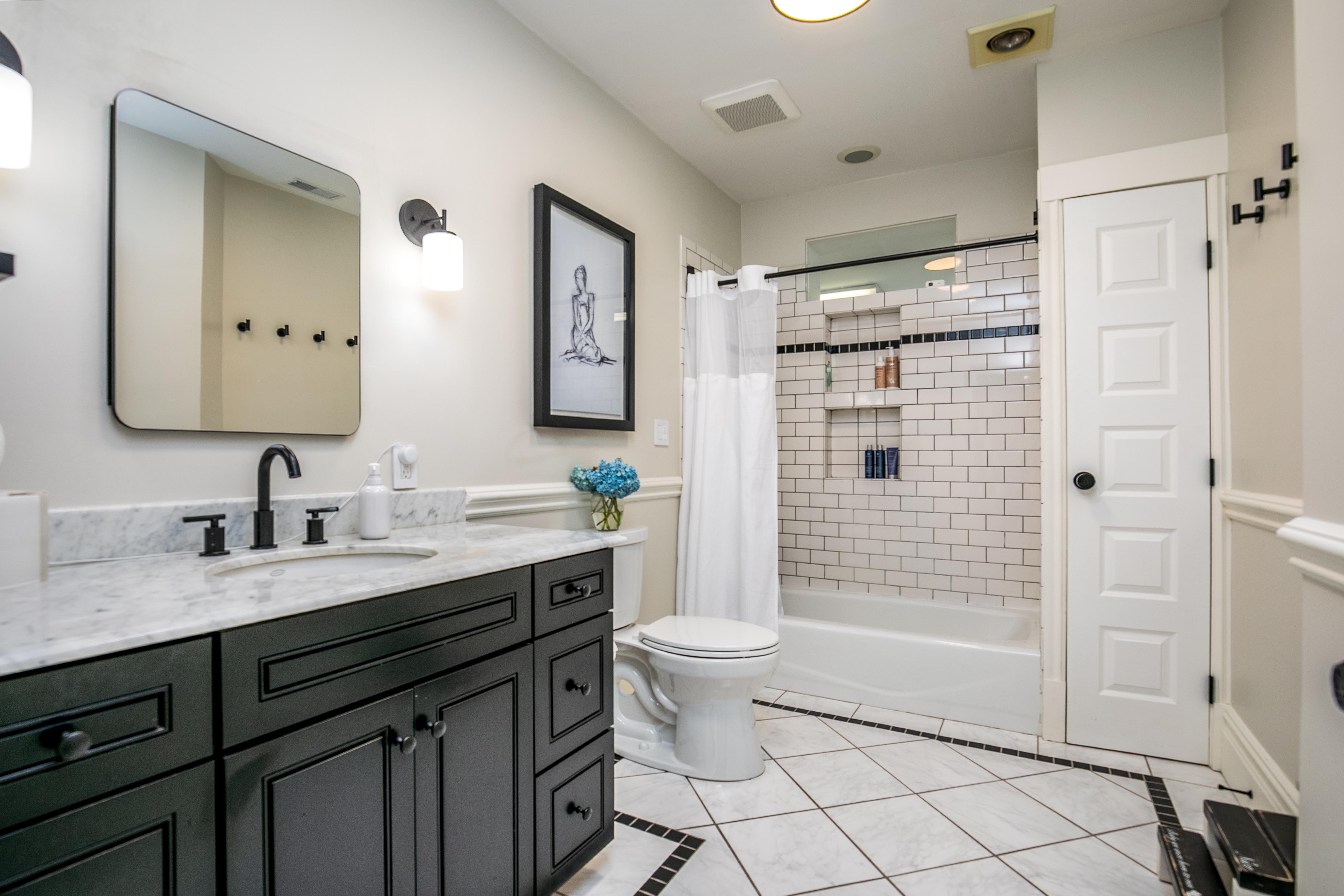 163 Ridge Road Rutherford, NJ 07070 - Photo 36 of 59 a bathroom with a double vanity sink toilet mirror and shower