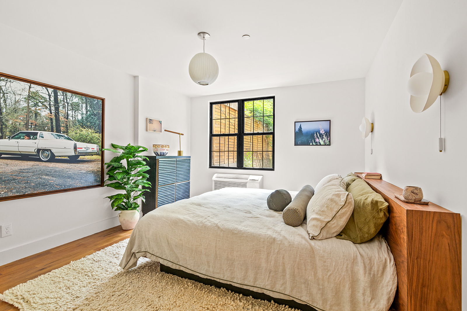 120 Pulaski Street, Unit 1B Brooklyn, NY 11206 - Photo 6 of 13 a bedroom with a bed and window