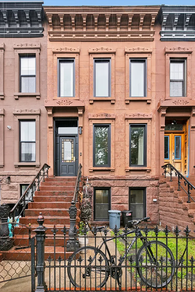 a view of a brick building with many windows