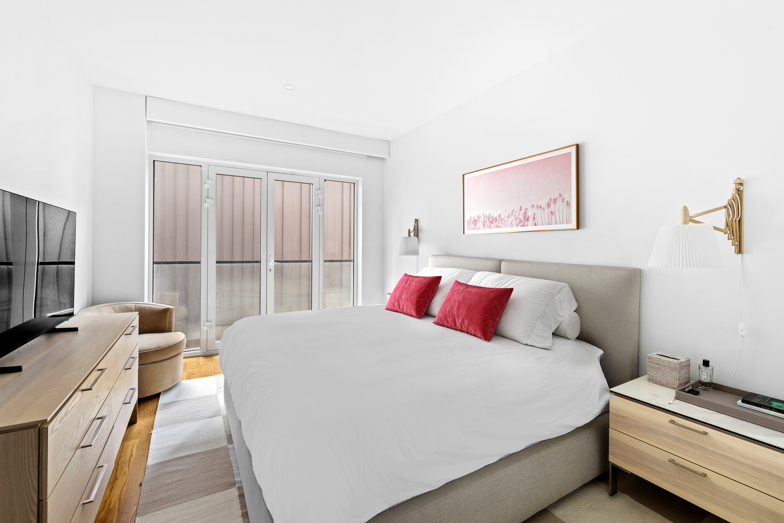 427 East 90th Street, Unit 5A Manhattan, NY 10128 - Photo 5 of 13 a bedroom with a bed and a window