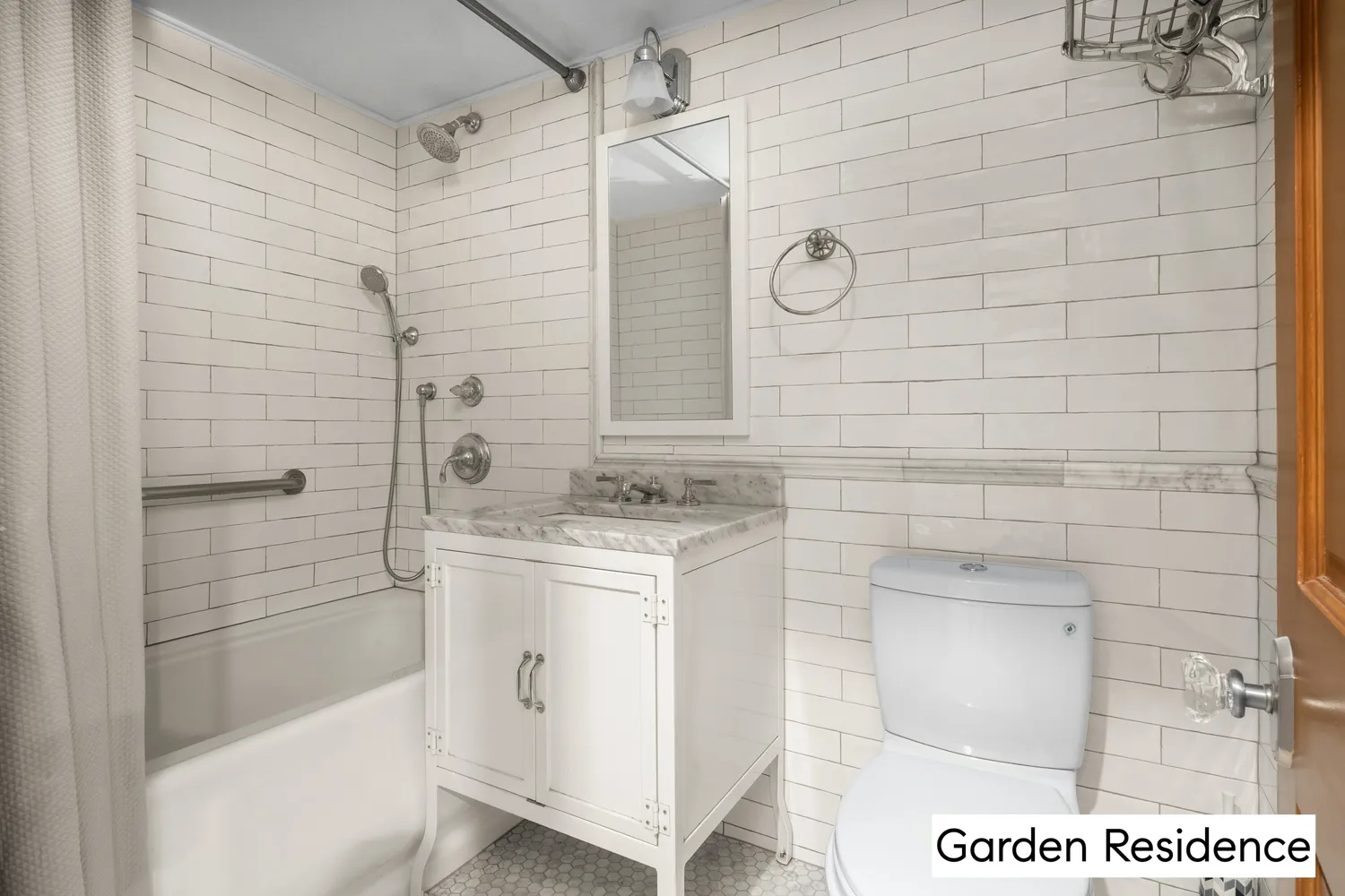 a bathroom with a shower and a sink