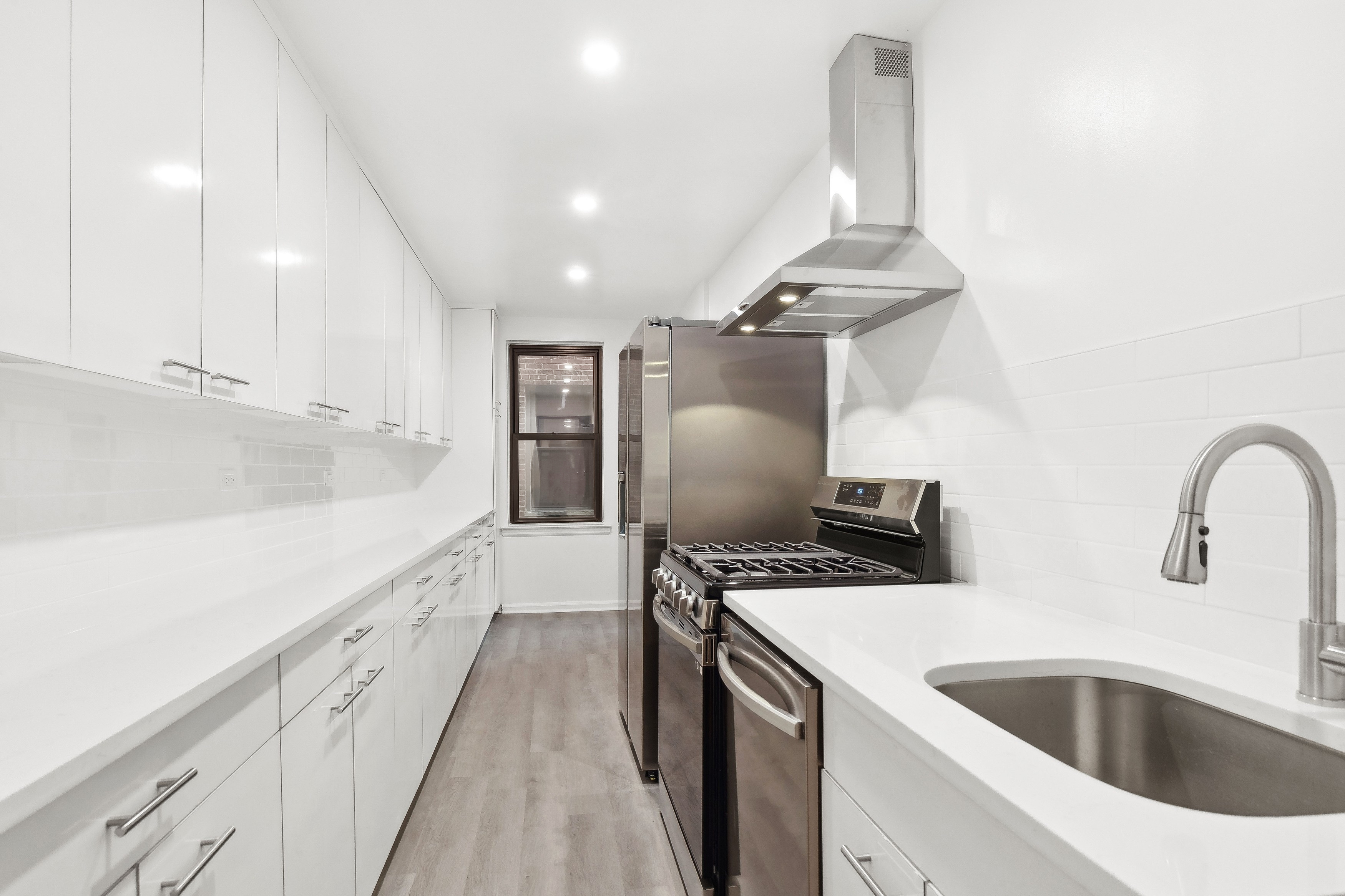 445 West 240th Street, Unit 3A Bronx, NY 10463 - Photo 1 of 8 a kitchen with stainless steel appliances a sink stove and refrigerator
