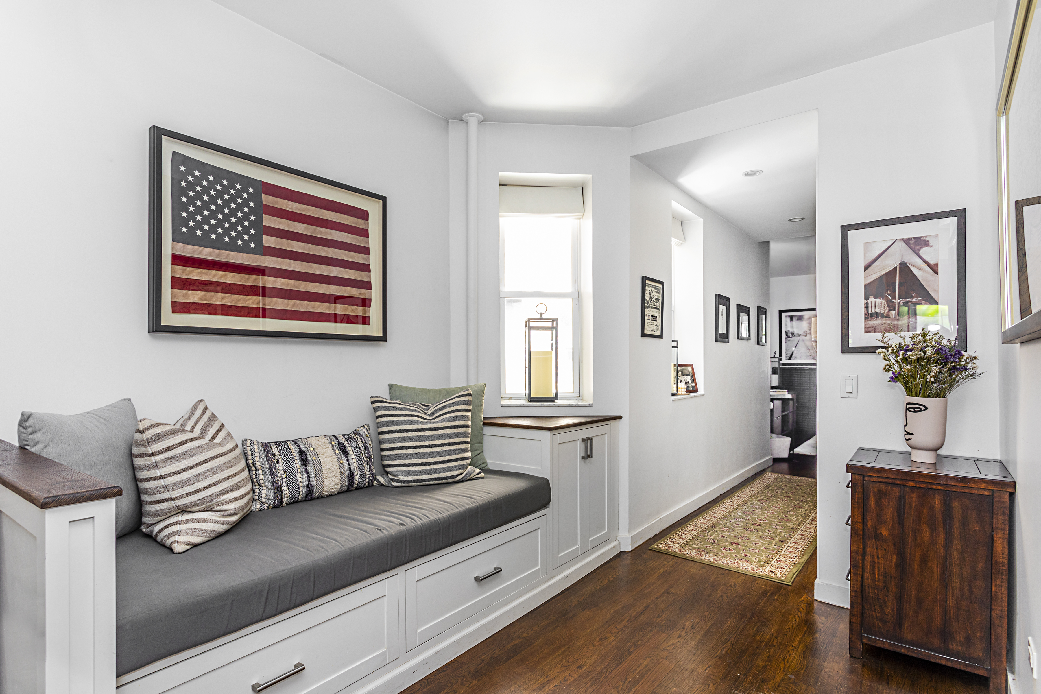 236 East 6th Street, Unit 2W Manhattan, NY 10003 - Photo 4 of 7 a living room with furniture and wooden floor