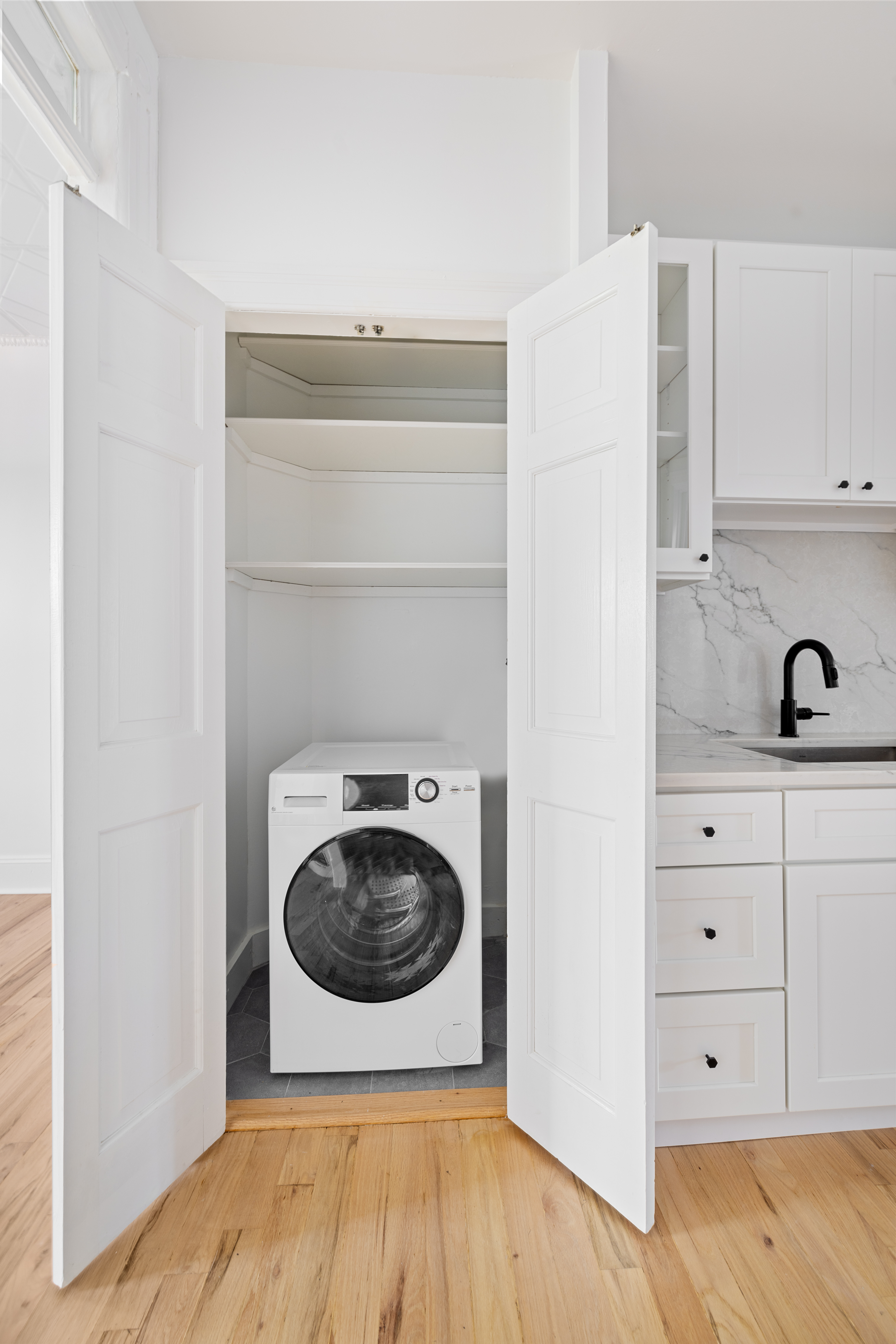 456 Prospect Avenue, Unit 3R Brooklyn, NY 11215 - Photo 3 of 16 a utility room with sink dryer and washer