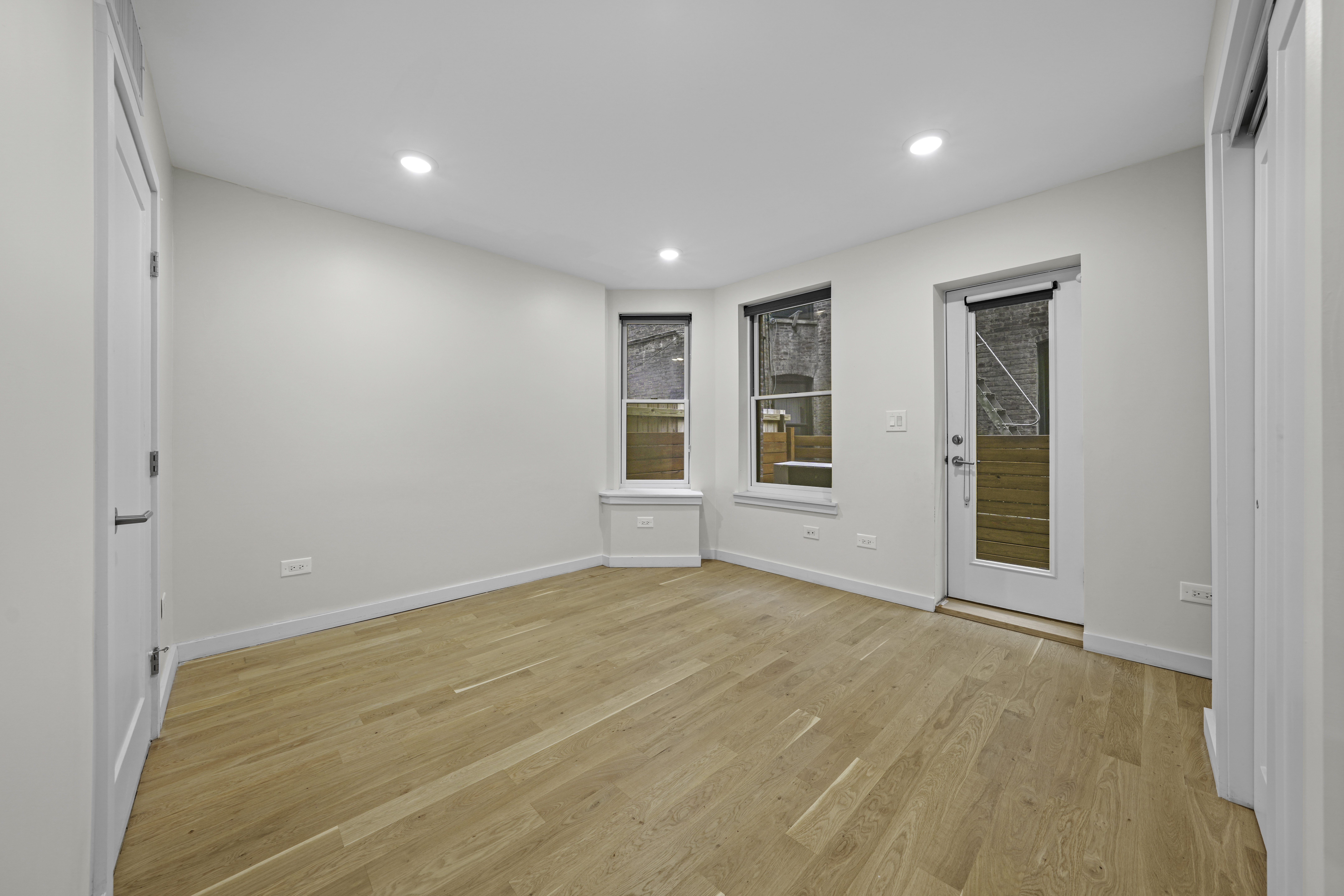 950 St Nicholas Avenue, Unit 1 Manhattan, NY 10032 - Photo 7 of 16 a view of an empty room with a window