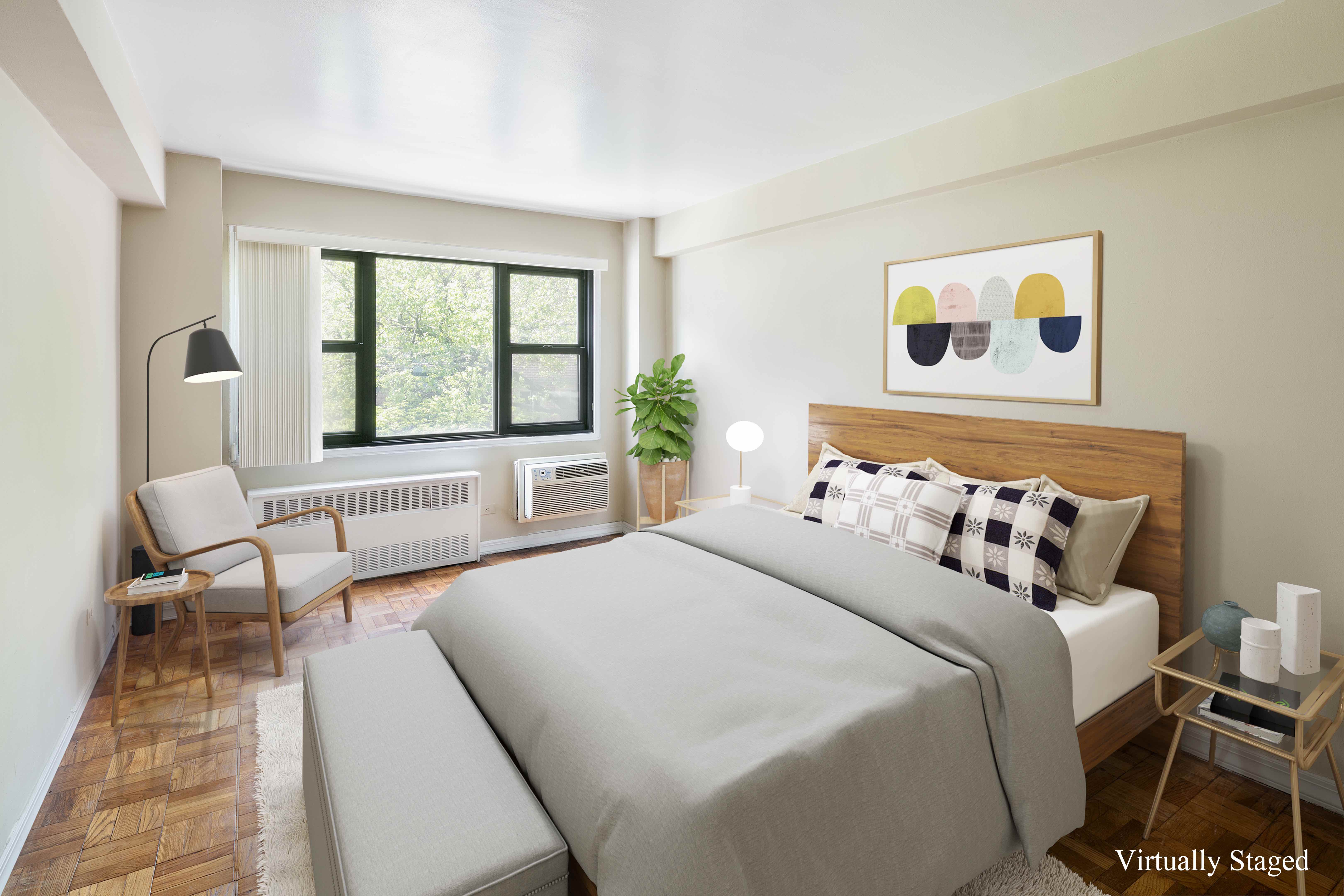 335 East 51st Street, Unit 2D Manhattan, NY 10022 - Photo 5 of 11 a bedroom with bed and a large window