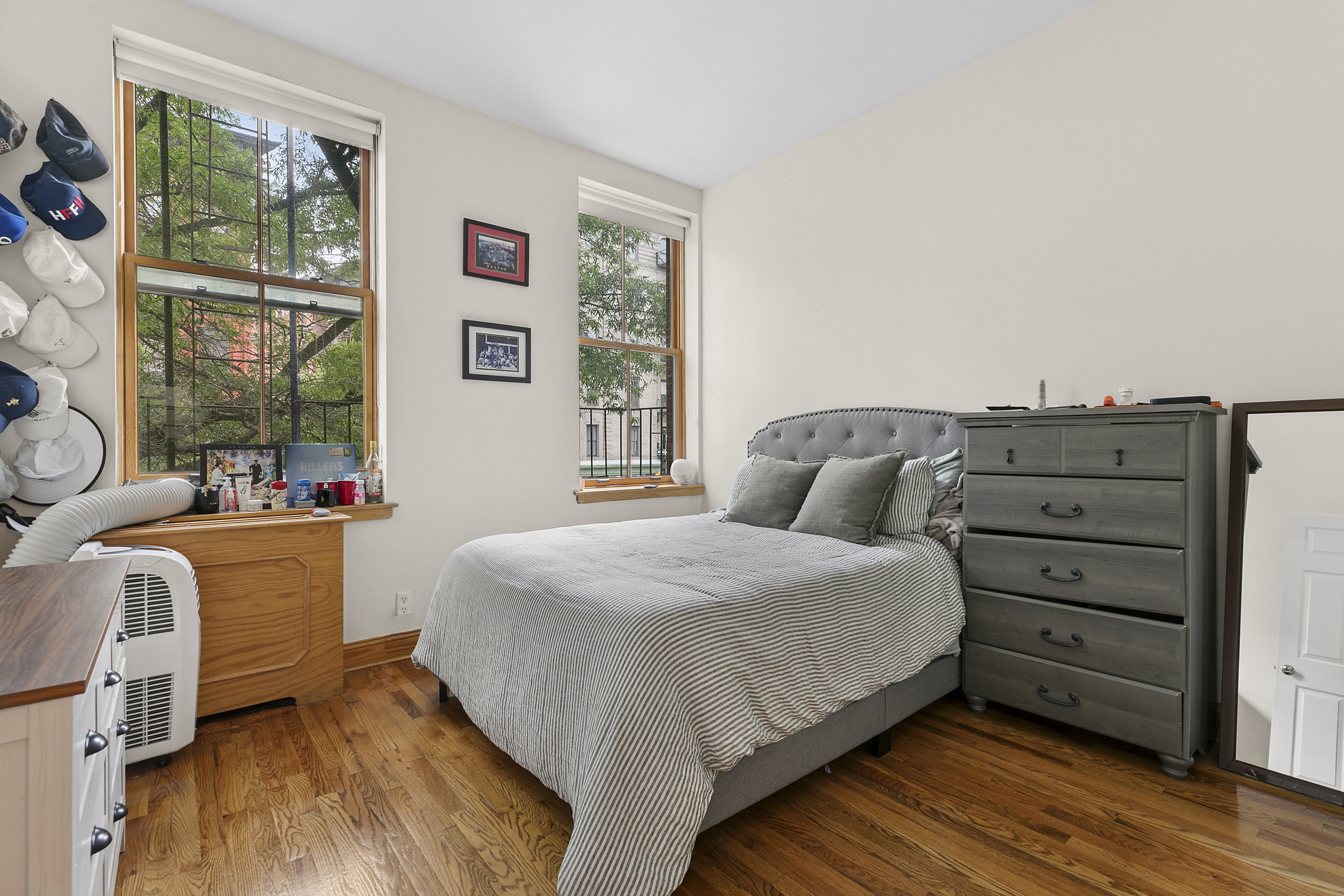 548 1/2 Hudson Street, Unit 2 Manhattan, NY 10014 - Photo 4 of 6 a spacious bedroom with a bed and a table
