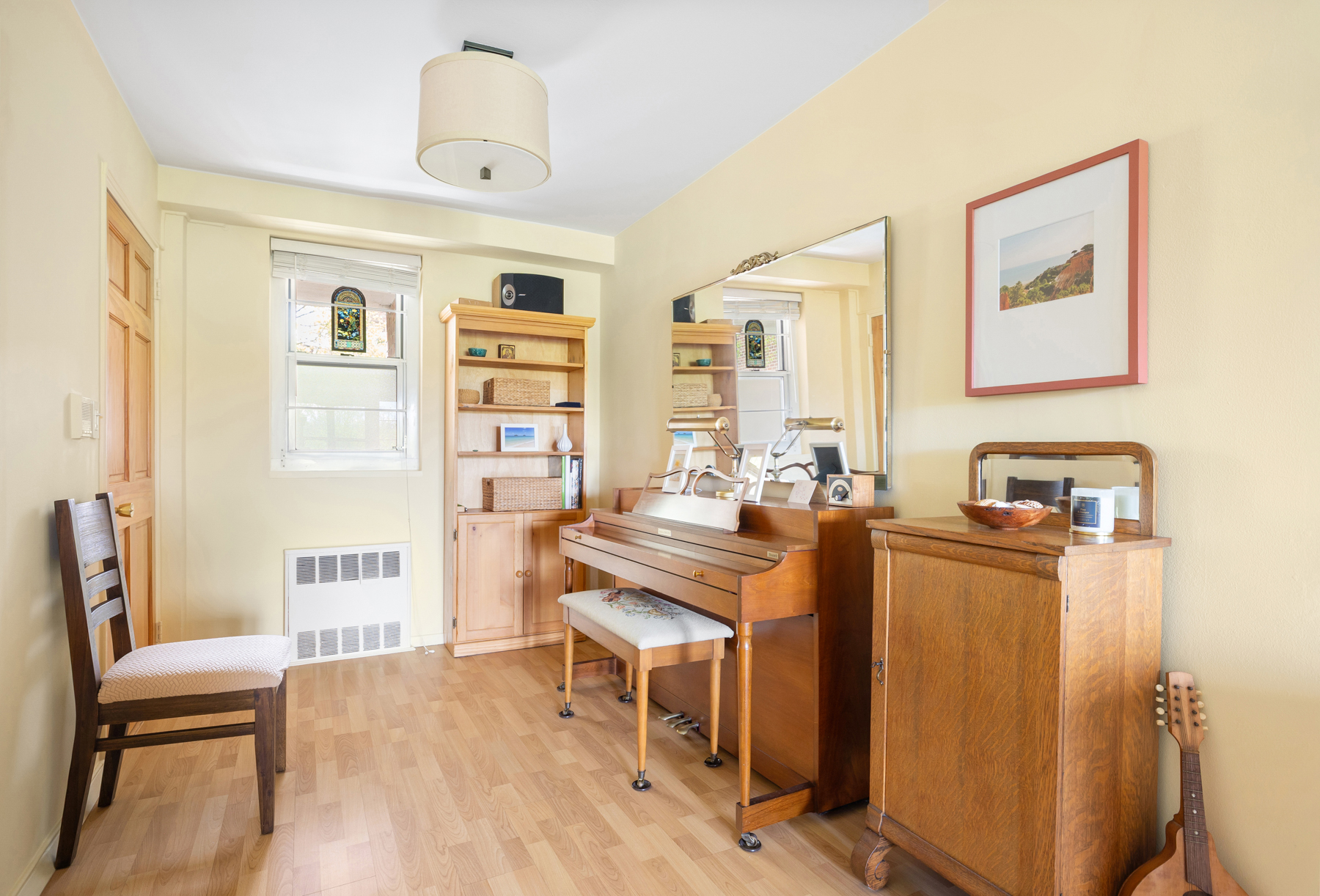 35-11 85th Street, Unit 5H Queens, NY 11372 - Photo 4 of 11 a view of a workspace with furniture and wooden floor