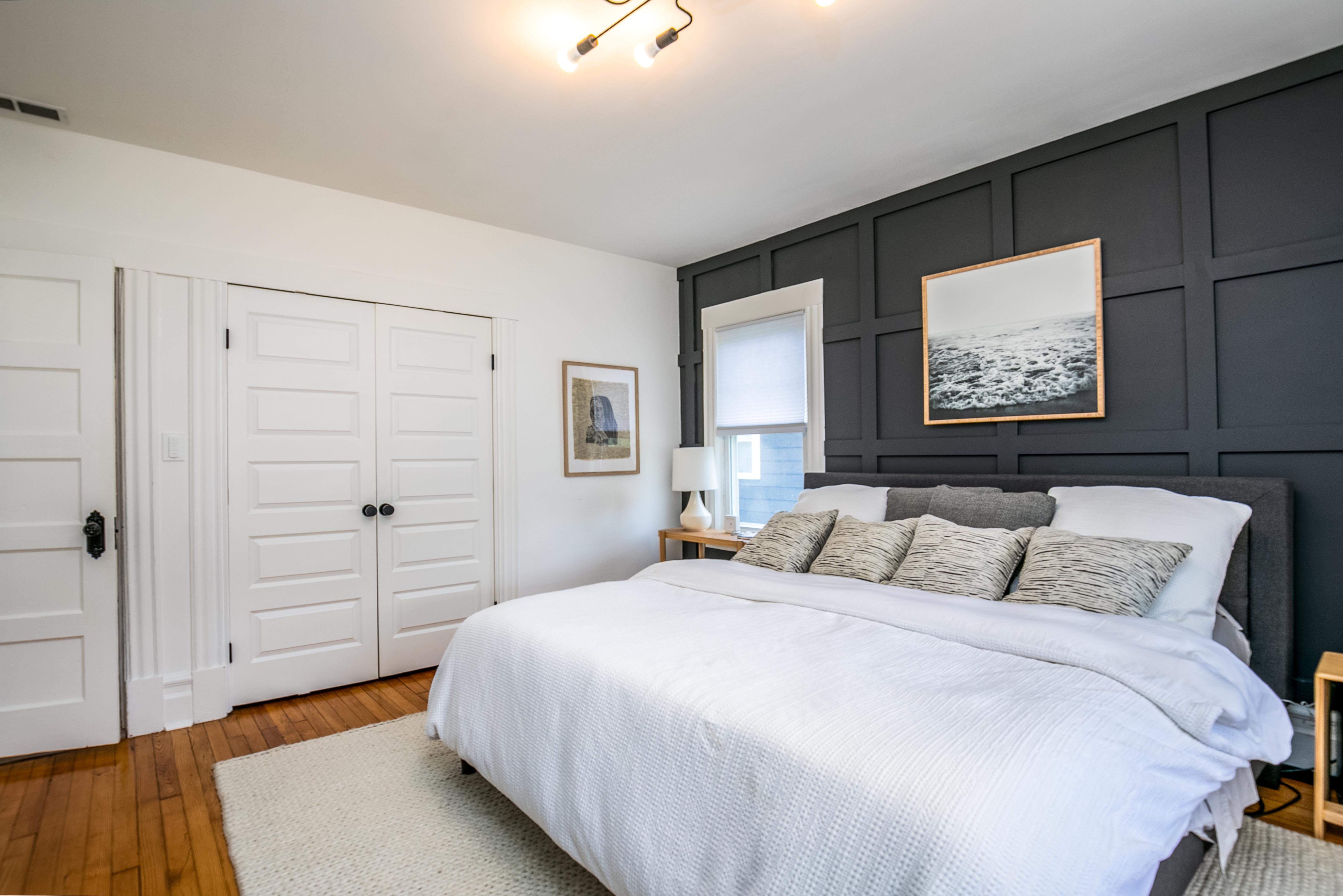 163 Ridge Road Rutherford, NJ 07070 - Photo 32 of 59 a bedroom with a bed and a painting on the wall