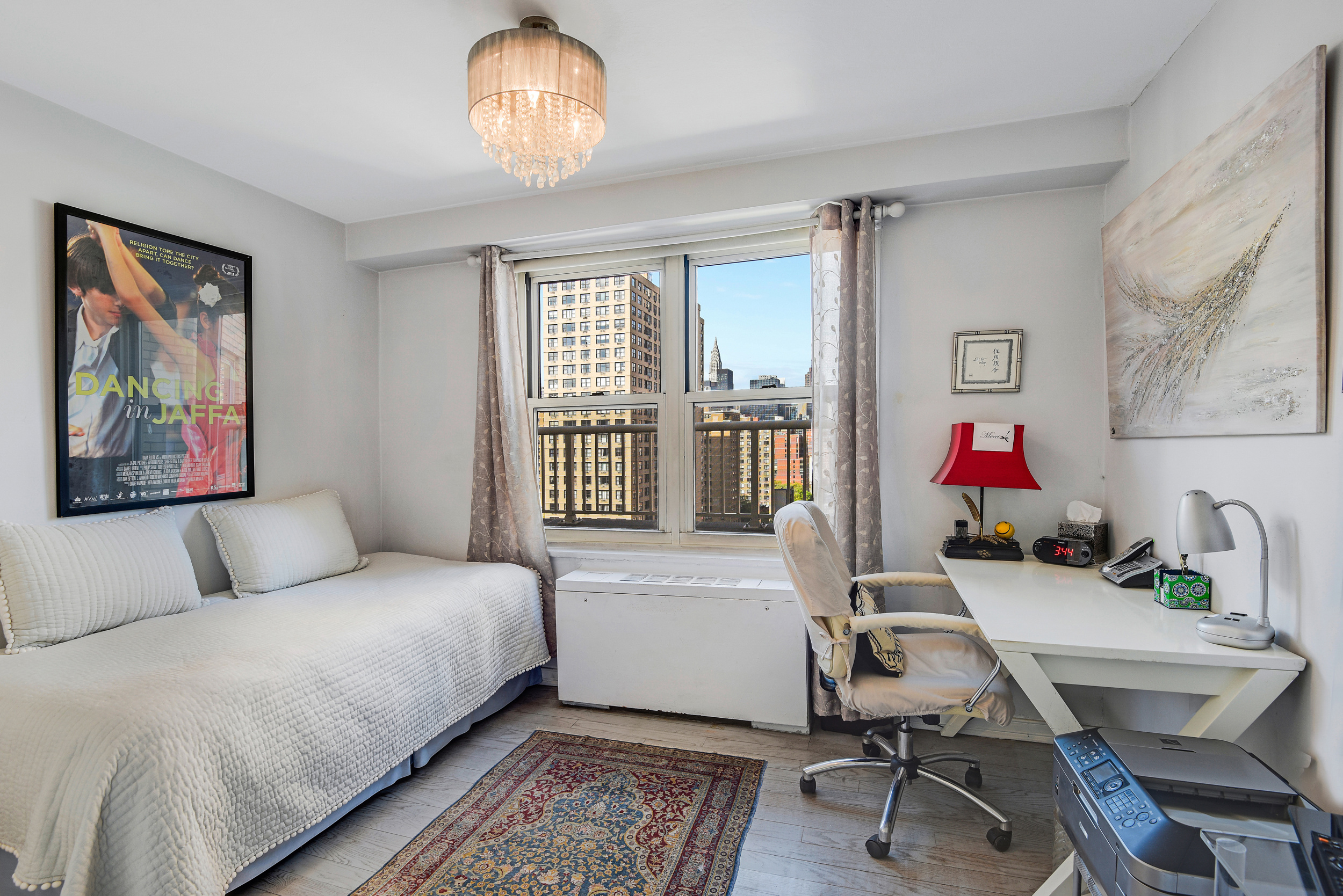 305 East 24th Street, Unit 18C Manhattan, NY 10010 - Photo 10 of 13 a bedroom with a bed and a desk