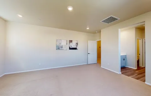 a spacious bathroom with a double vanity sink and a mirror