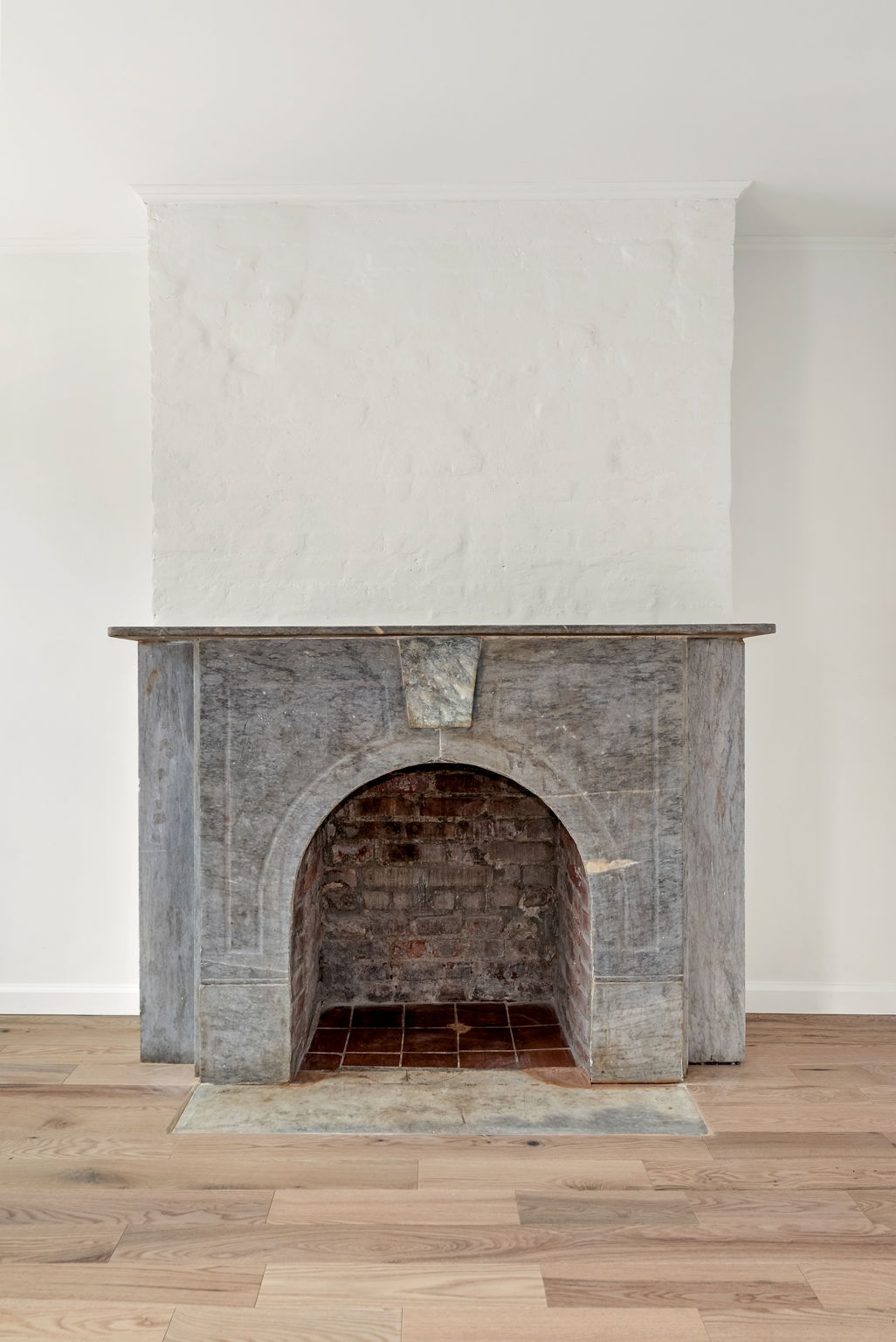 54 East 4th Street, Unit 1 Brooklyn, NY 11218 - Photo 6 of 12 a stone house with a fireplace in it