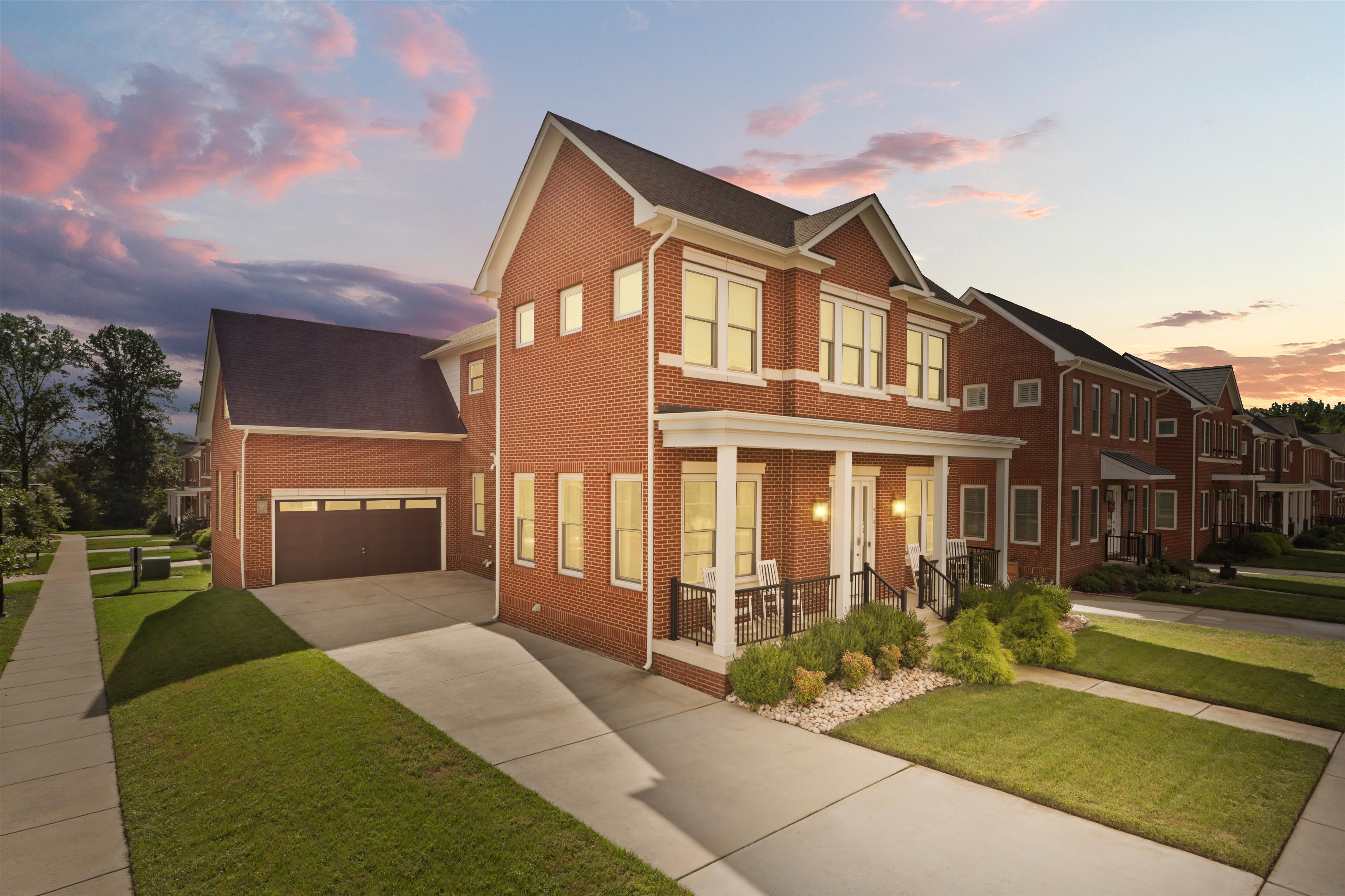 a front view of a house with a yard